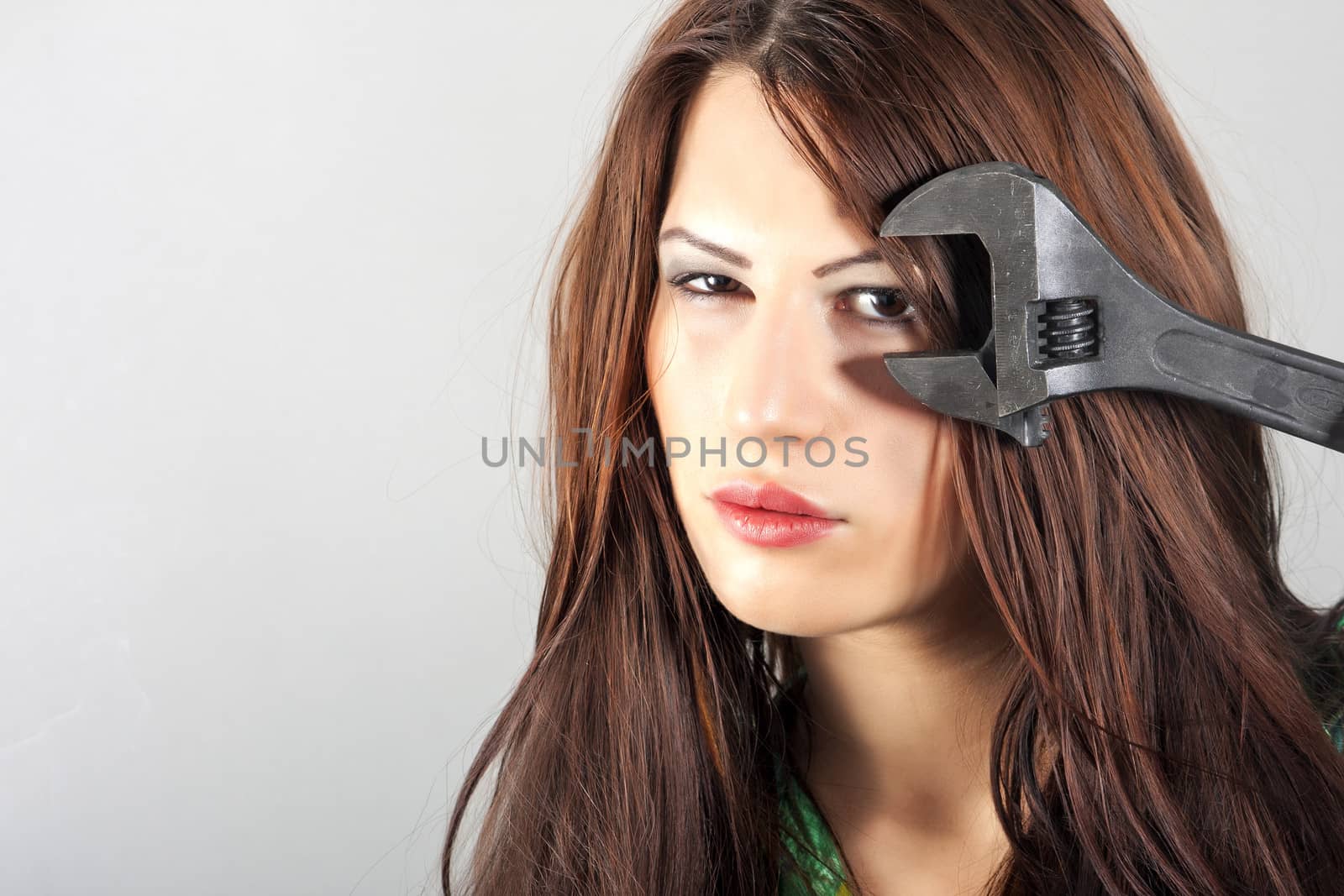 portrait of girl with adjustable wrench