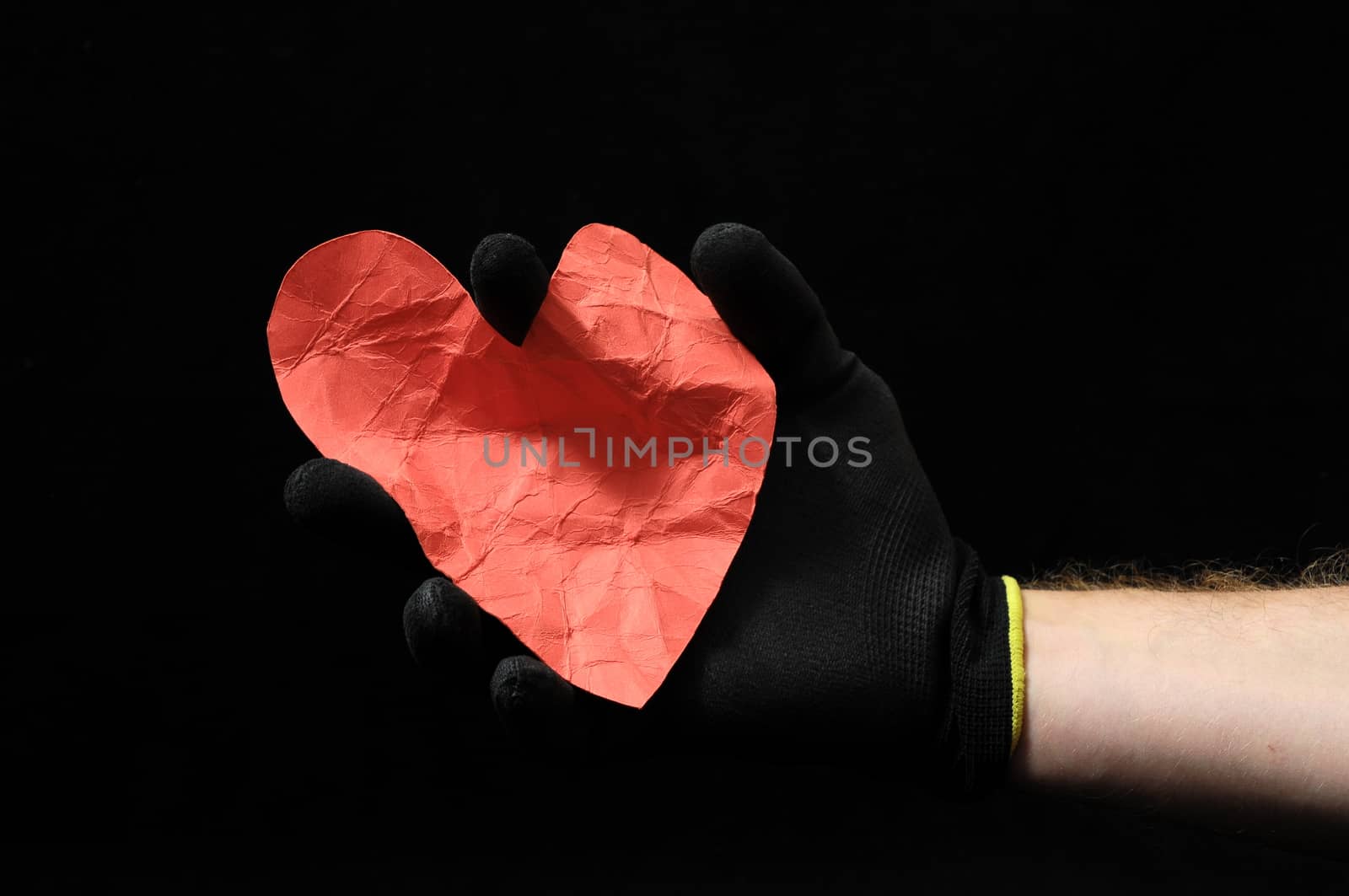 Heart And an Hand on a Black Background