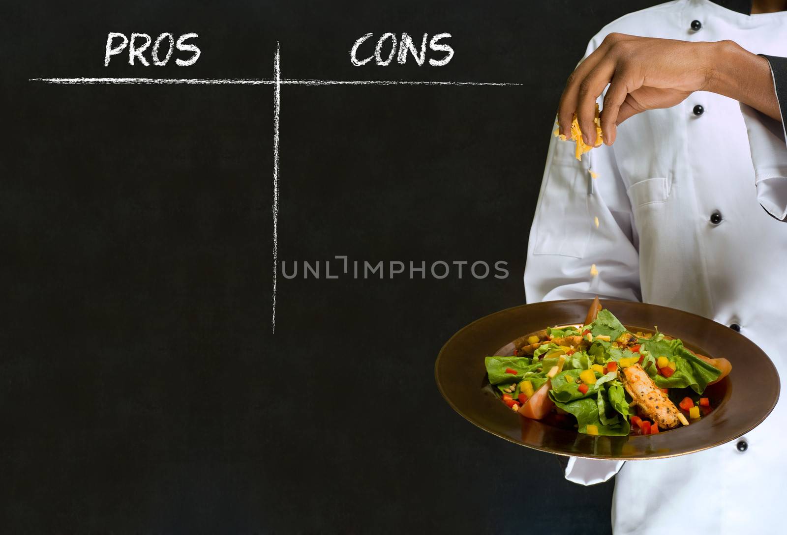 African American woman chef with chalk pros and cons on blackboard background by alistaircotton