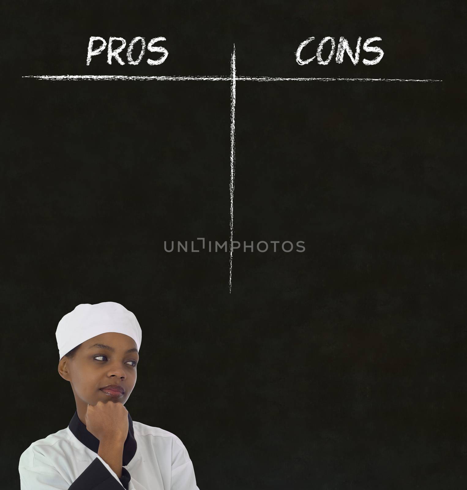 African American woman chef thinking with chalk pros and cons on blackboard background by alistaircotton