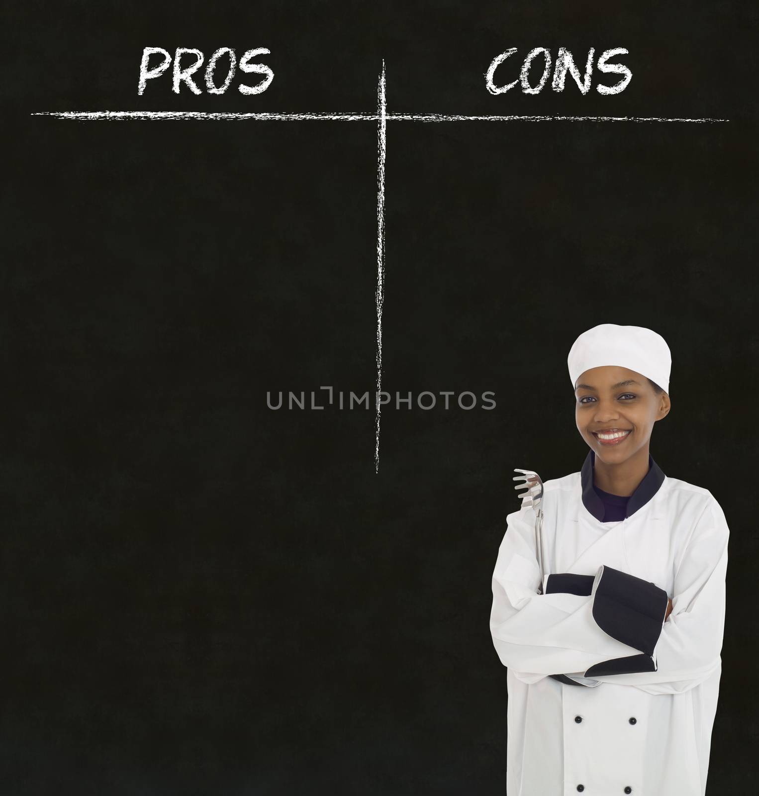 African American woman chef holding utensil with chalk pros and cons on blackboard background