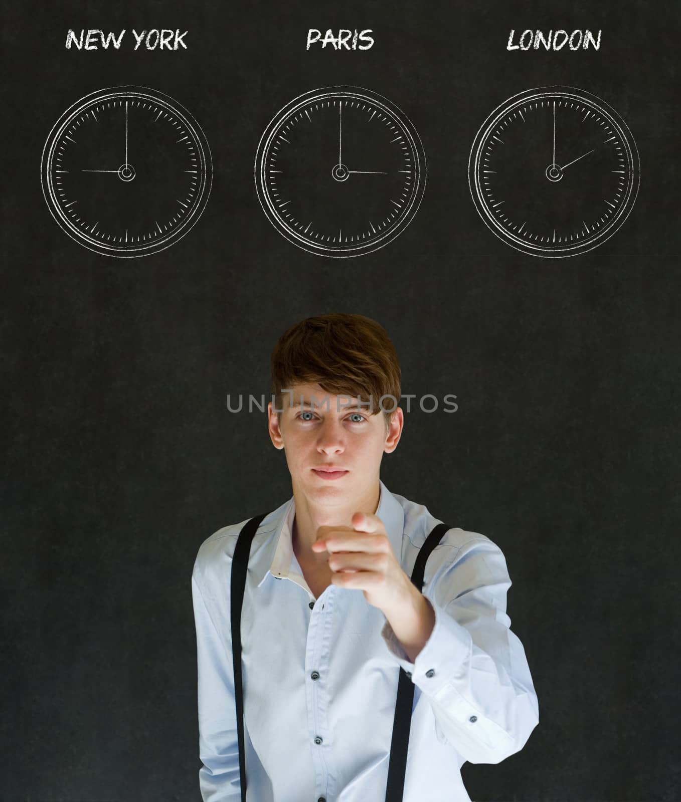 Businessman pointing with New York, Paris and London chalk time zone clocks on blackboard background