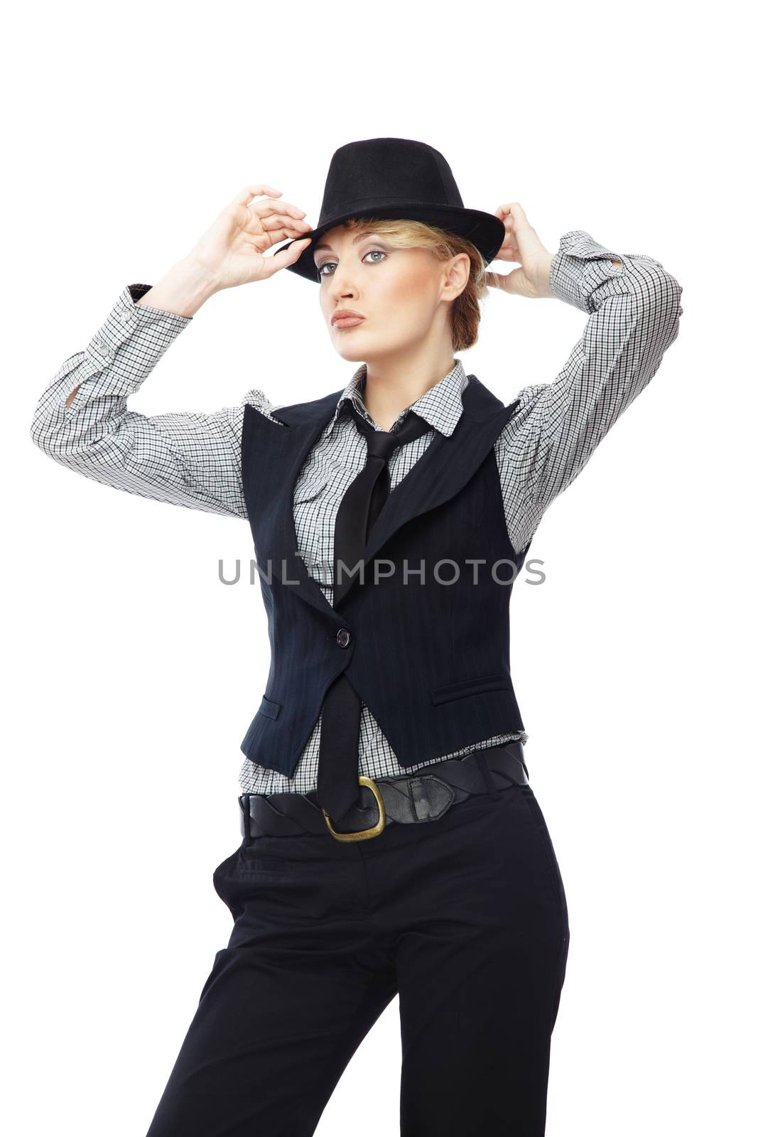 Sexy lady in stylish business clothes adjusting black hat