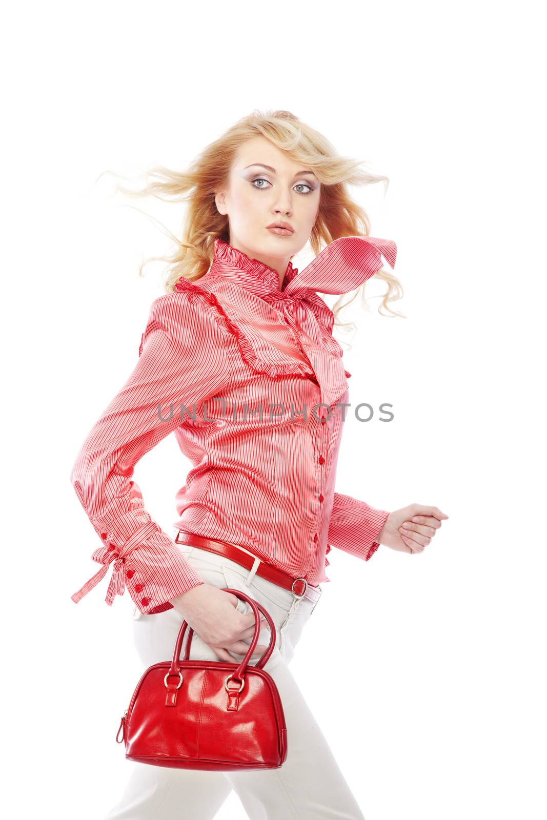 Moving lady in stylish clothes with red bag