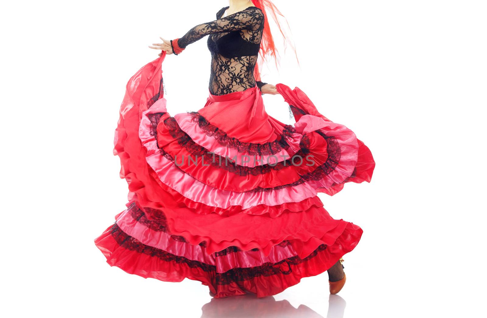 Woman in the red petticoat dancing flamenco