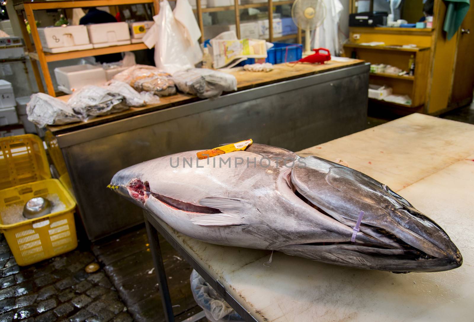 Big tuna on table for cutting by gjeerawut