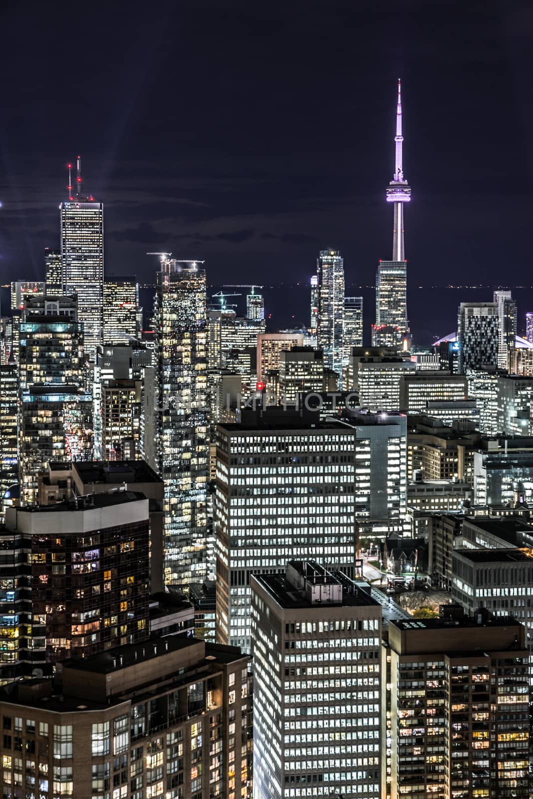 Full view of downtown Toronto at night with glamour lights