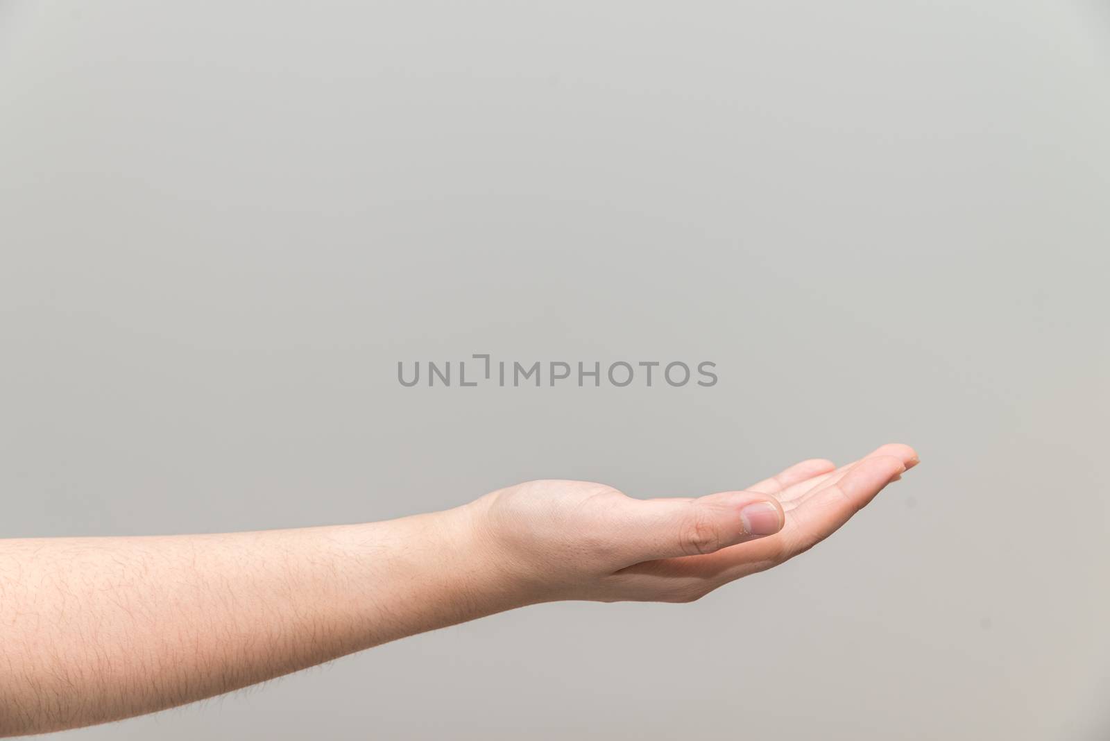 Hand with open palm facing up by IVYPHOTOS