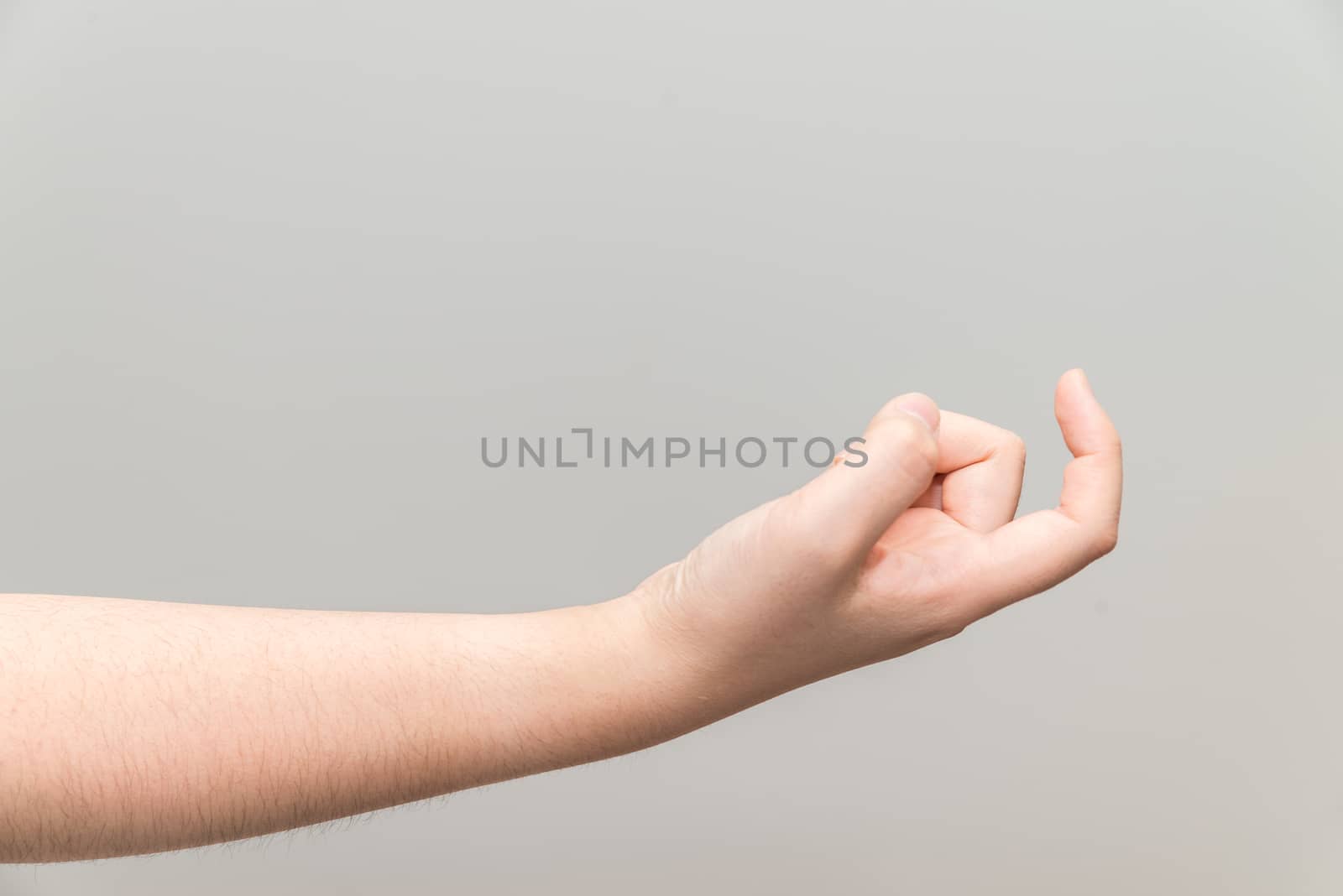 Human hand with curl index finger on light gray background