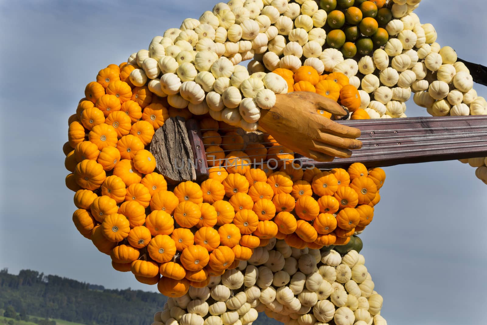 Guitar and guitarist made of small orange, green and wh by snowwhite