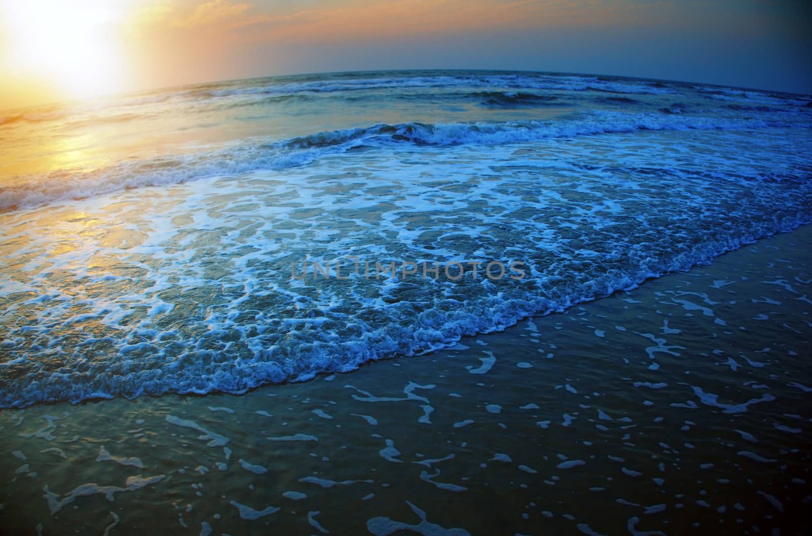 Colorful seascape during sunset. Natural darkness added