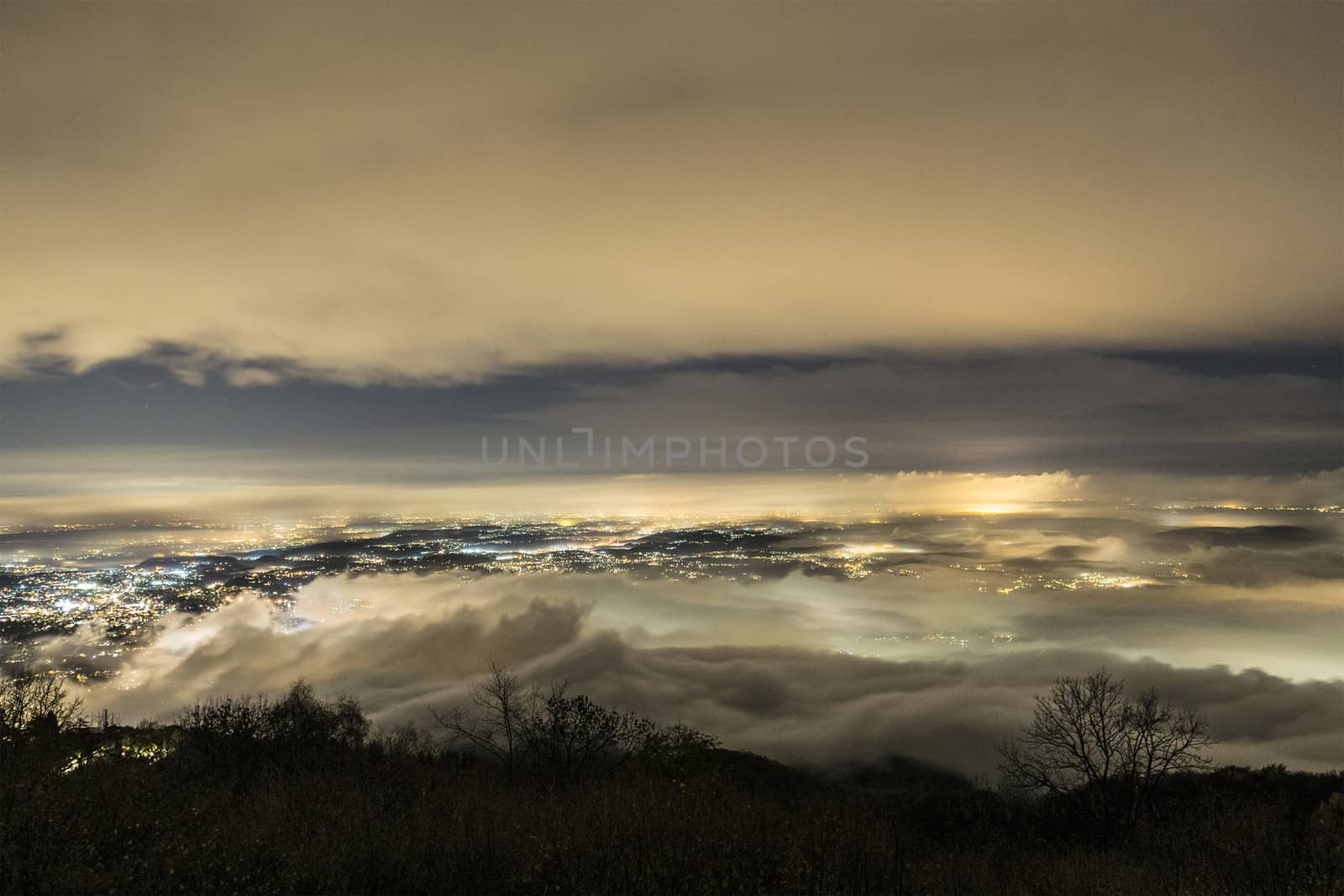 Foggy night over Varese city, Lombardy by Mdc1970