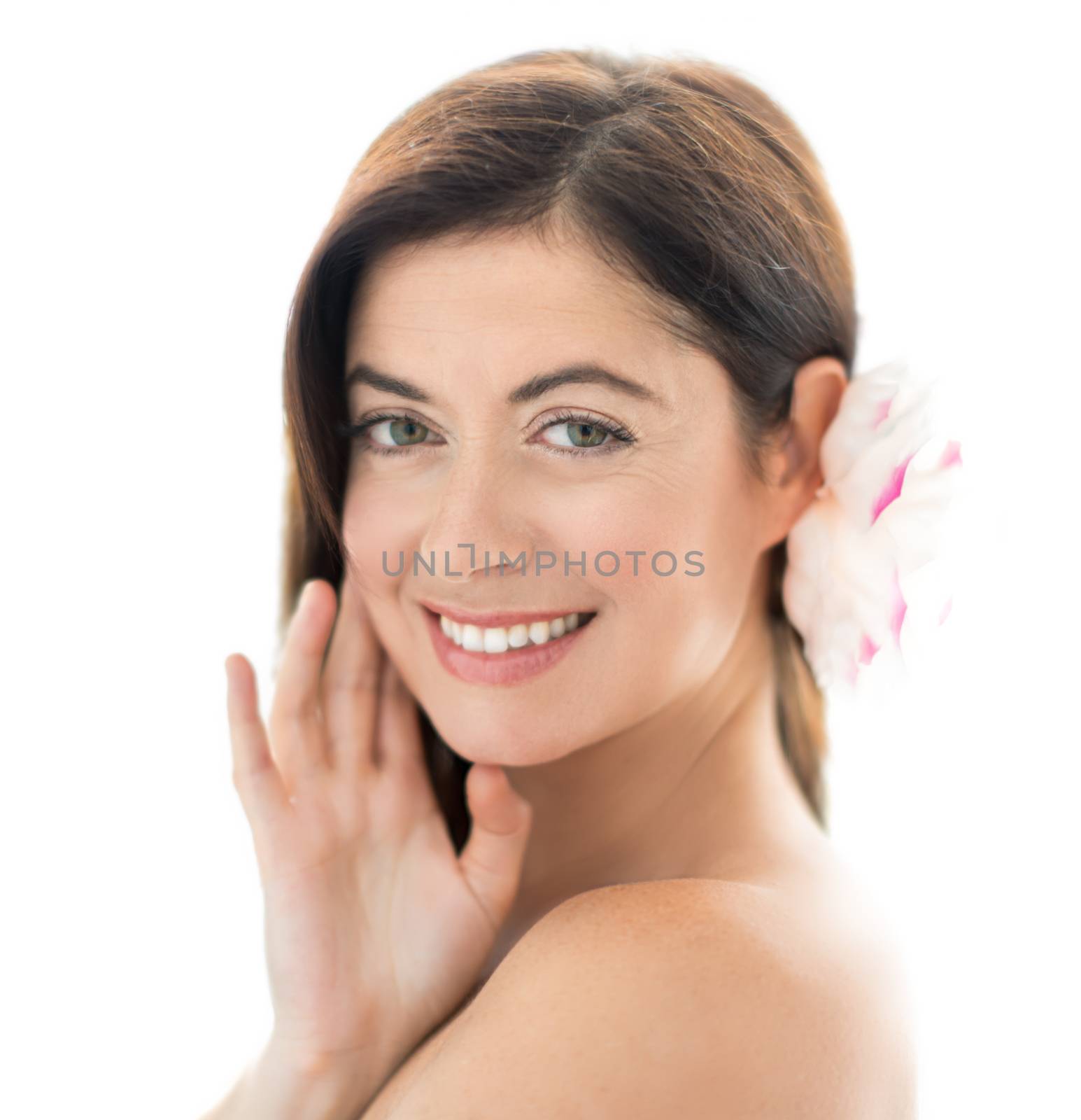 portrait of a beautiful mature lady touching her face