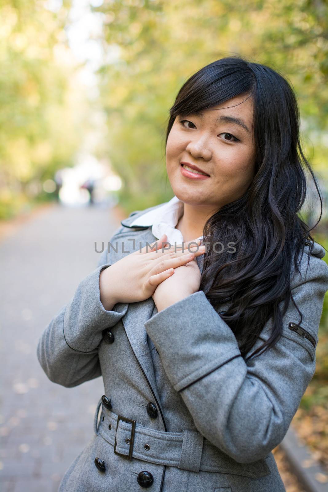 Portrait of woman on road by IVYPHOTOS