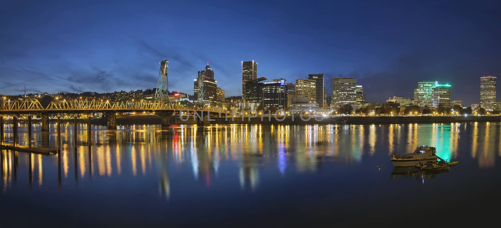 Portland Oregon Downtown Skyline with Hawthorne Bridge Along the Banks of Willamette River at Evening Blue Hour Panorama