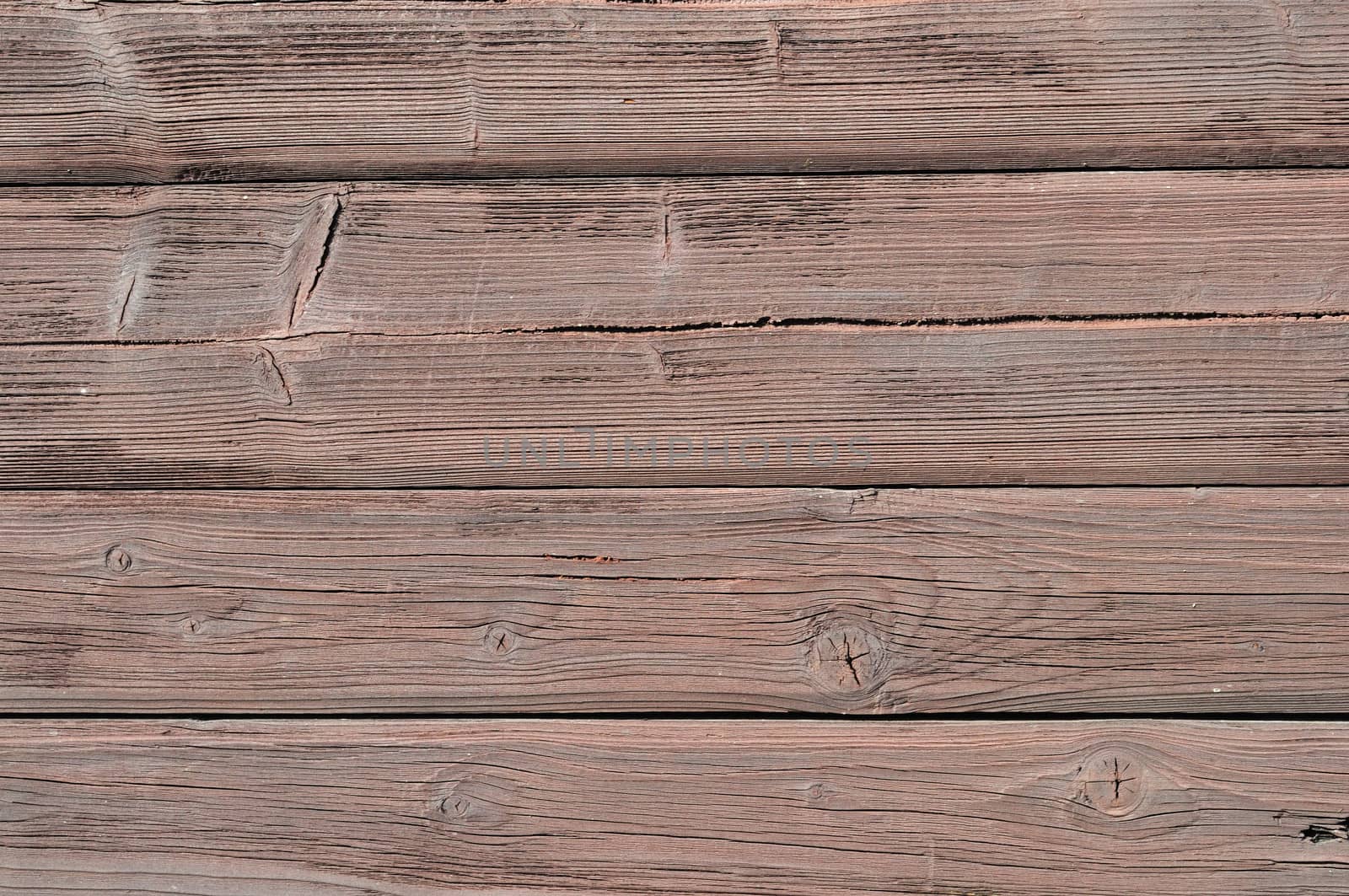 Close up of brown colored rough wooden boards background