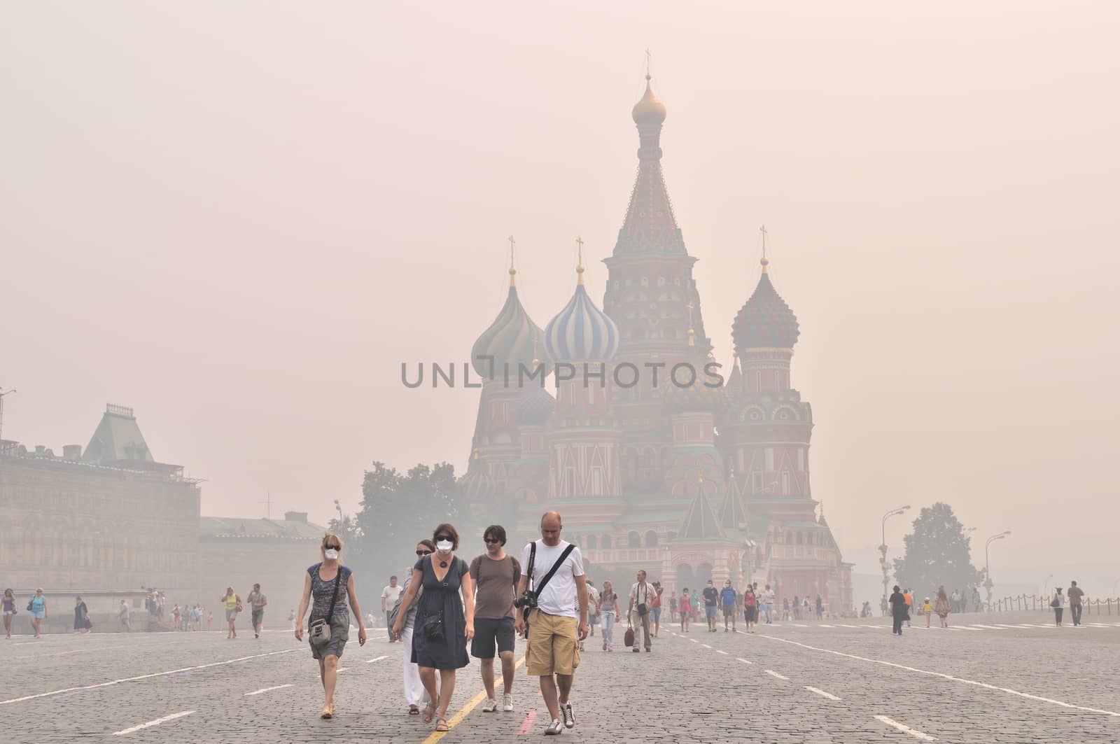 Tourists in gas mask on Red Square under the smog, Moscow, August 9, 2010 by wander