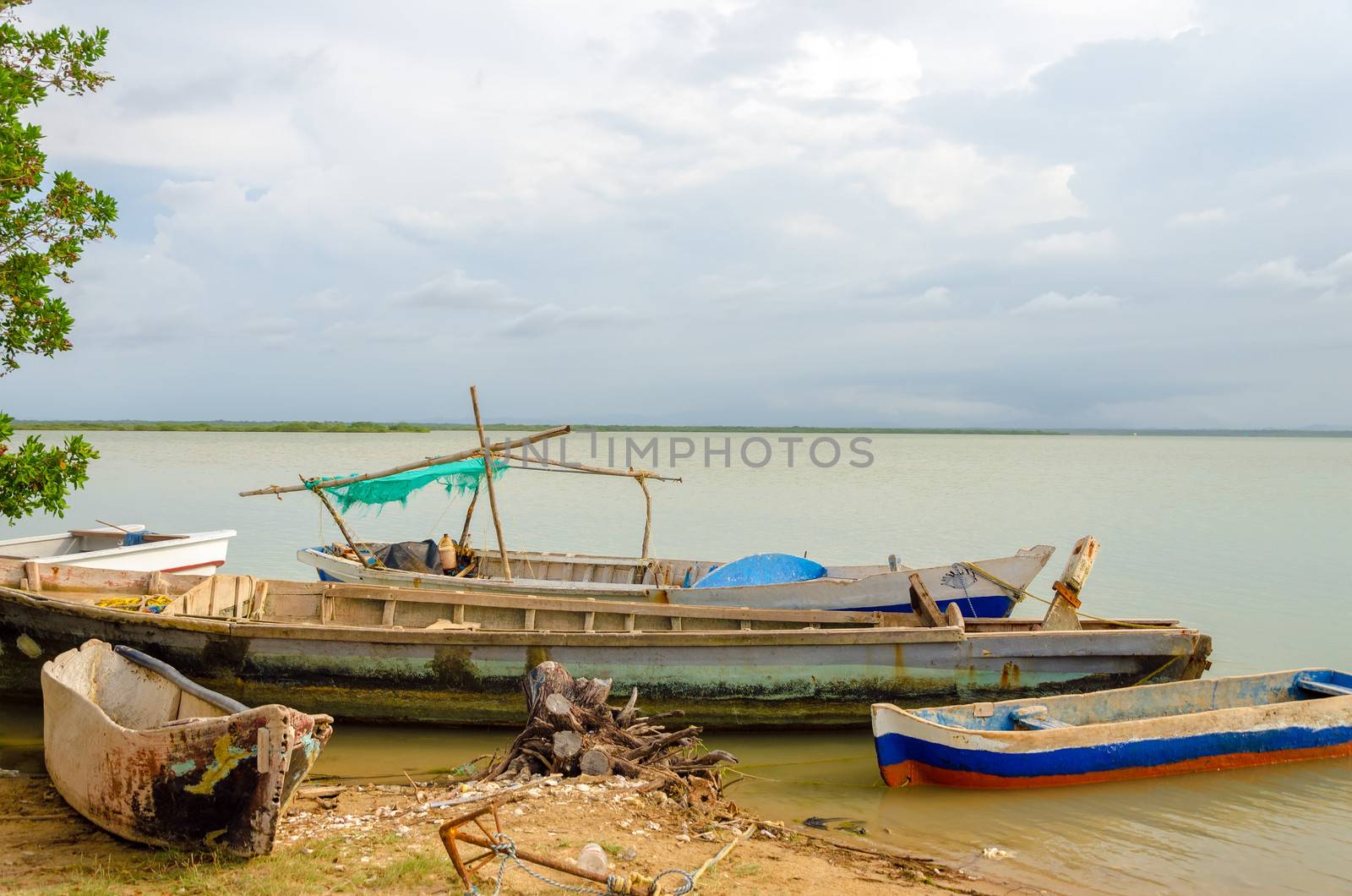 Old canoes on the shore of a lagoon in Camarones in La Guajira, Colombia