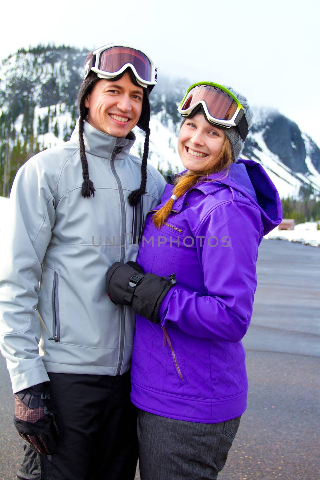 Happy Snowboarding Couple by joshuaraineyphotography