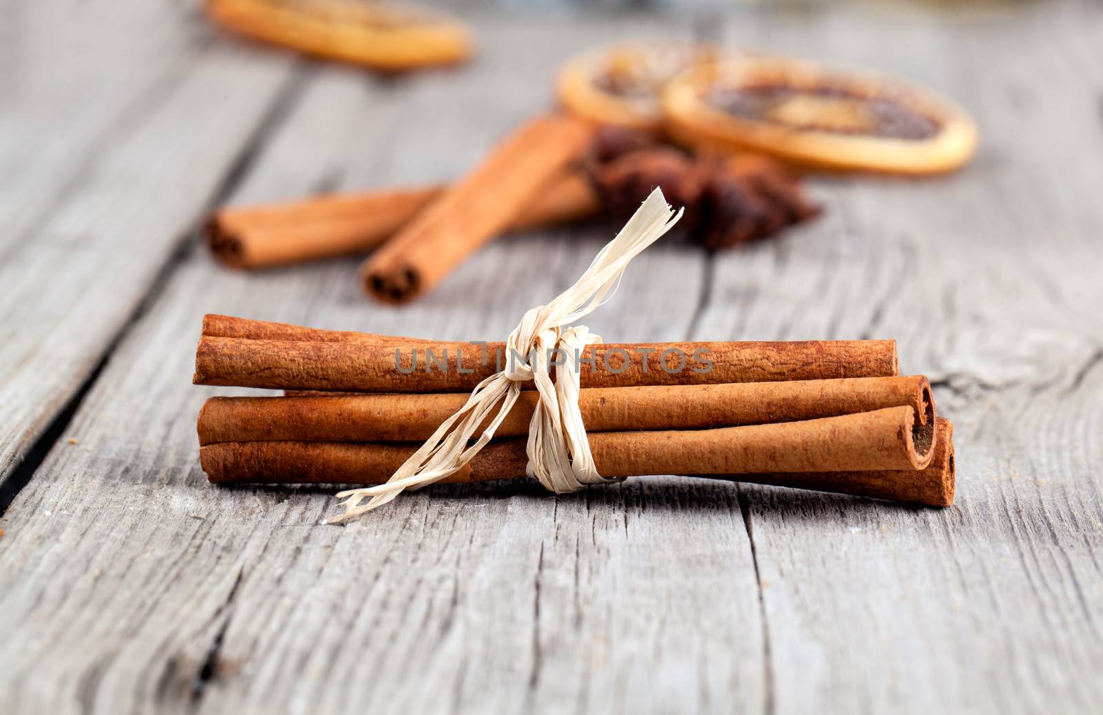 Cinnamon sticks, close up on wooden table