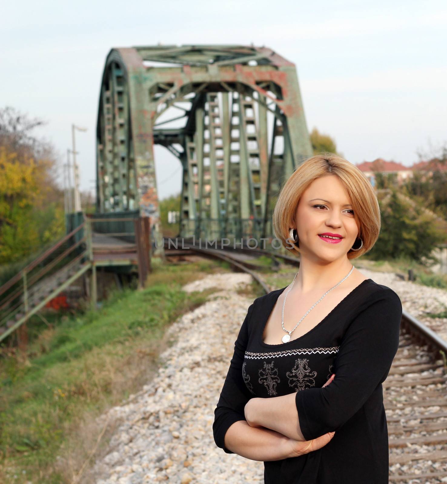 beautiful woman on railroad portrait by goce