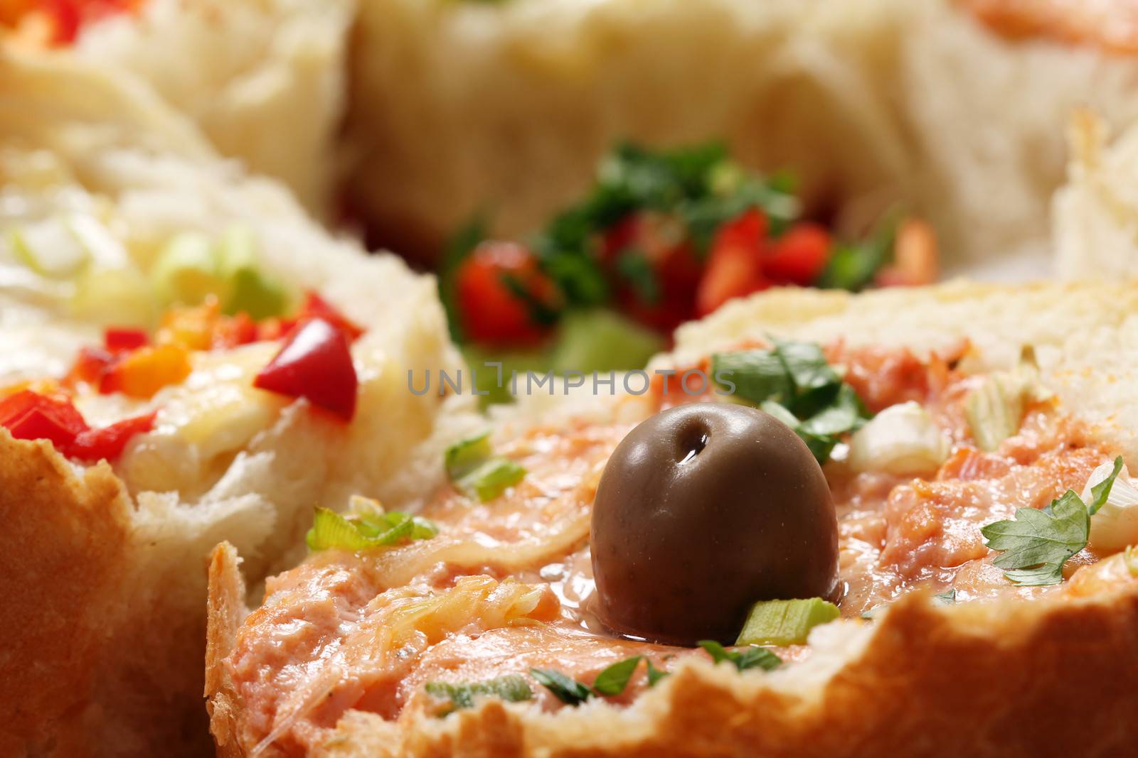 bread filled with cheese and vegetables food background by goce