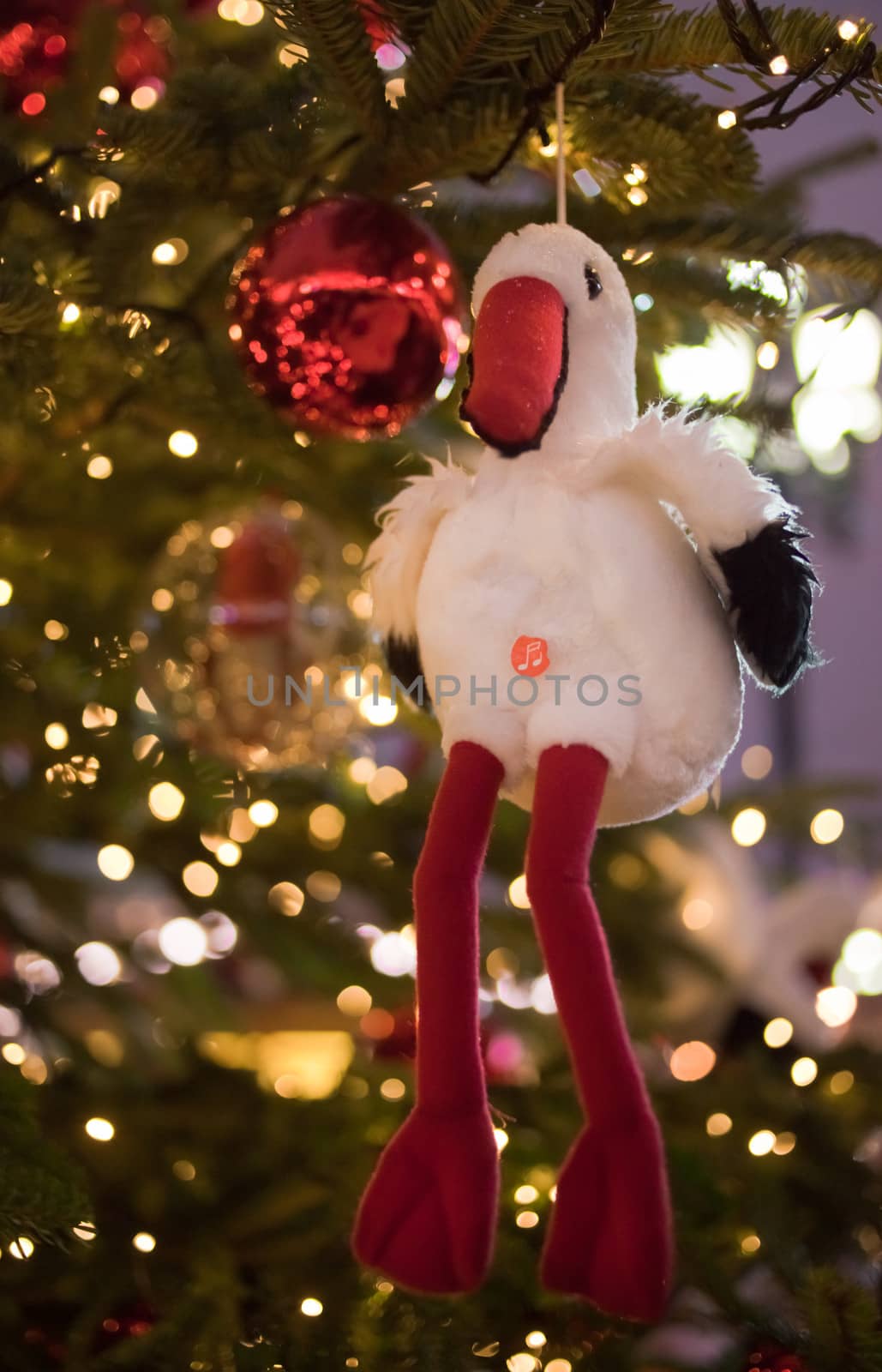 Christmas card with white stork on a new year tree by vicdemid