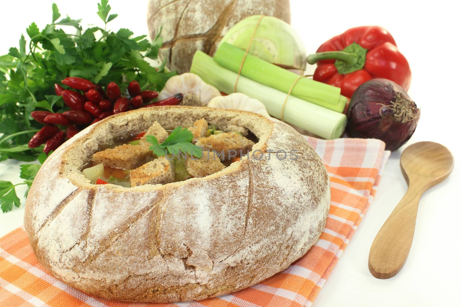 a farmhouse bread stuffed with a colorful bread soup