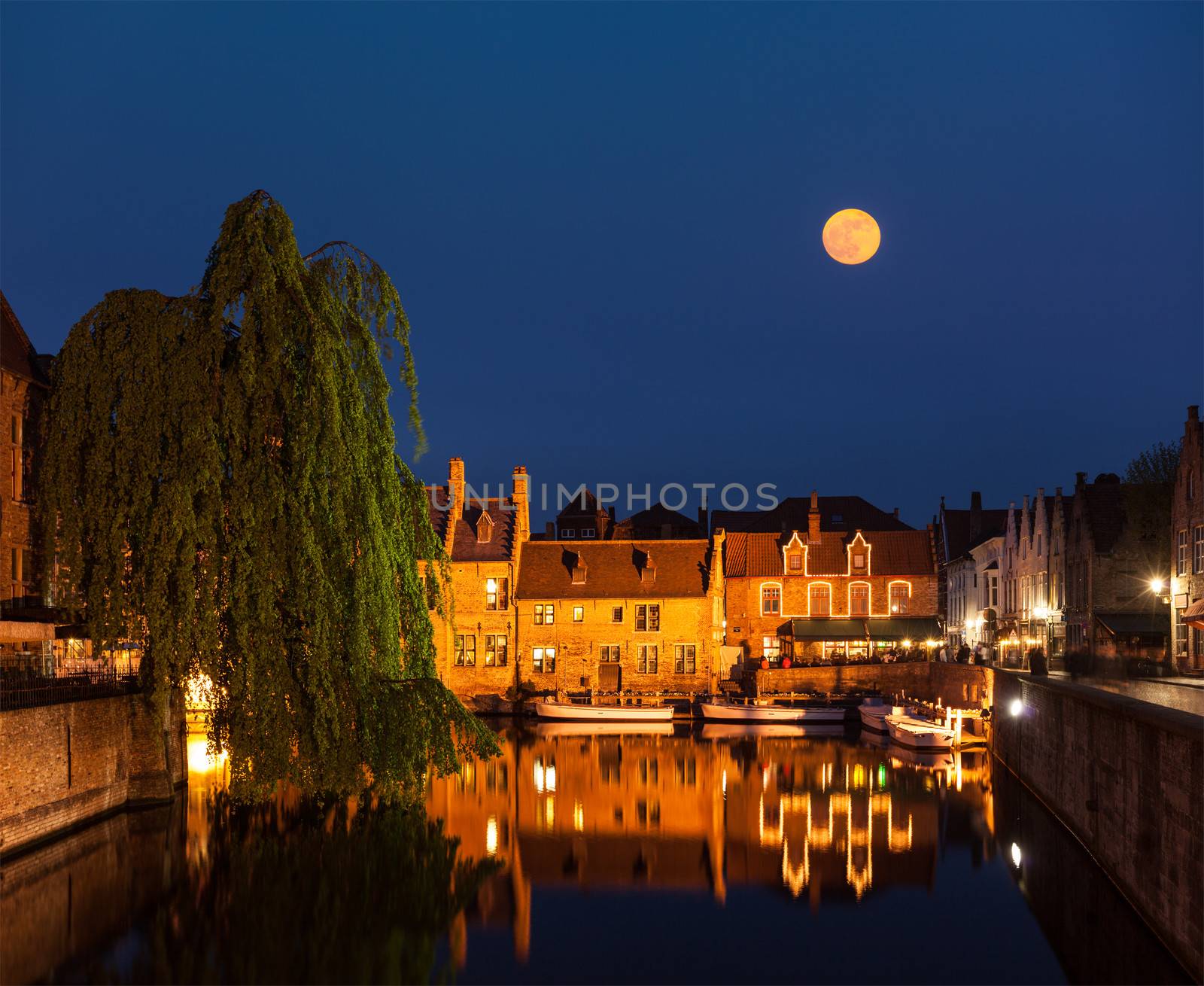 Canal and medieval houses in twilight. Bruges (Brugge), Belgium