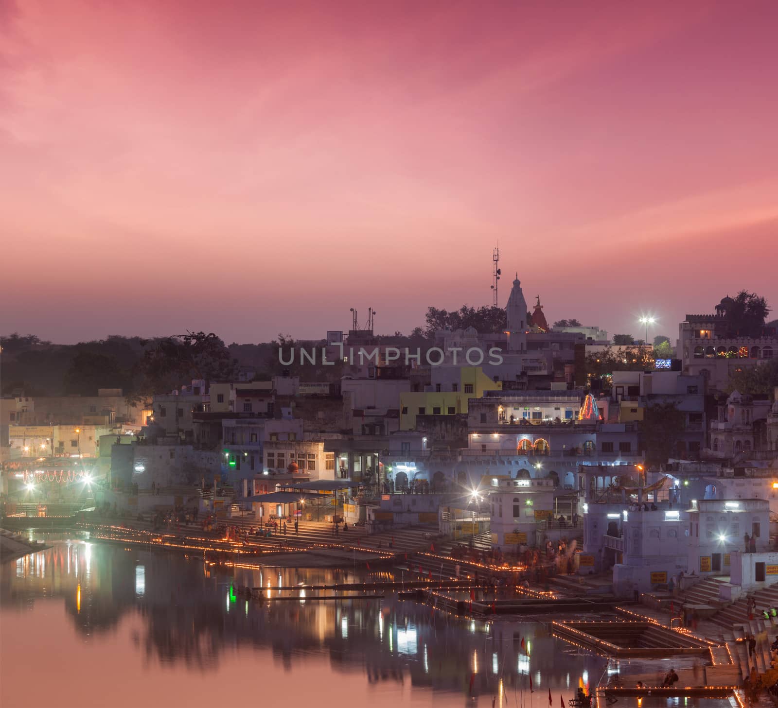 Sacred Puskhar lake (Sagar) and ghats of  town Pushkar in twilight in the evening, Rajasthan, India