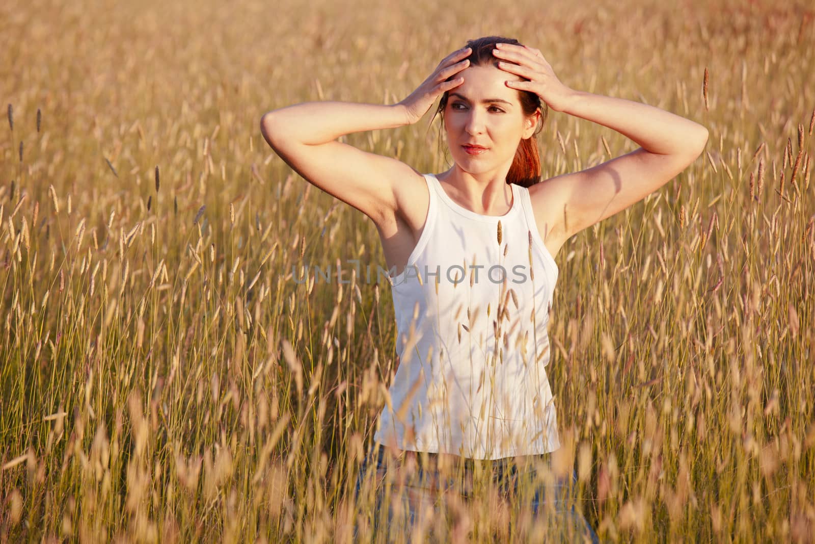 Outdoor portrait of a woman on a meadow releaxing