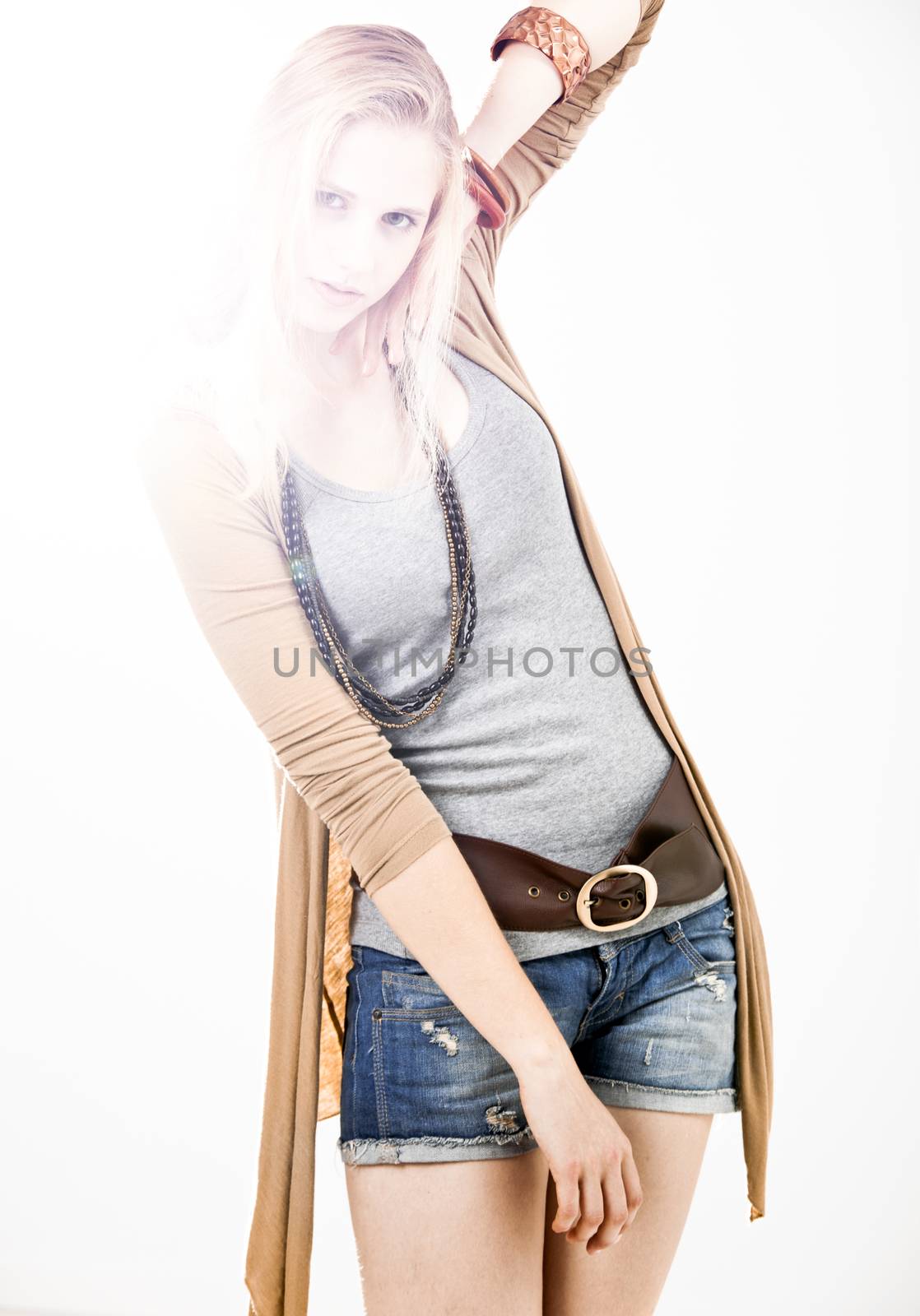 Beautiful fashion woman posing over a white background