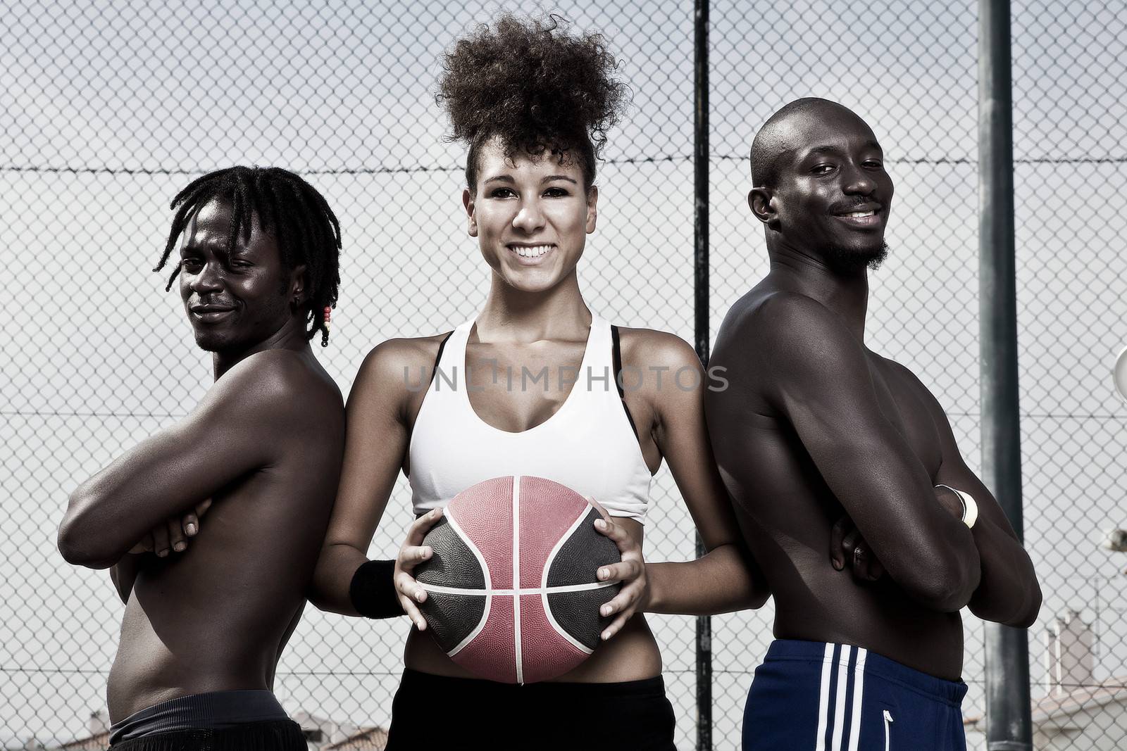 Group portrait of male and female street basket team