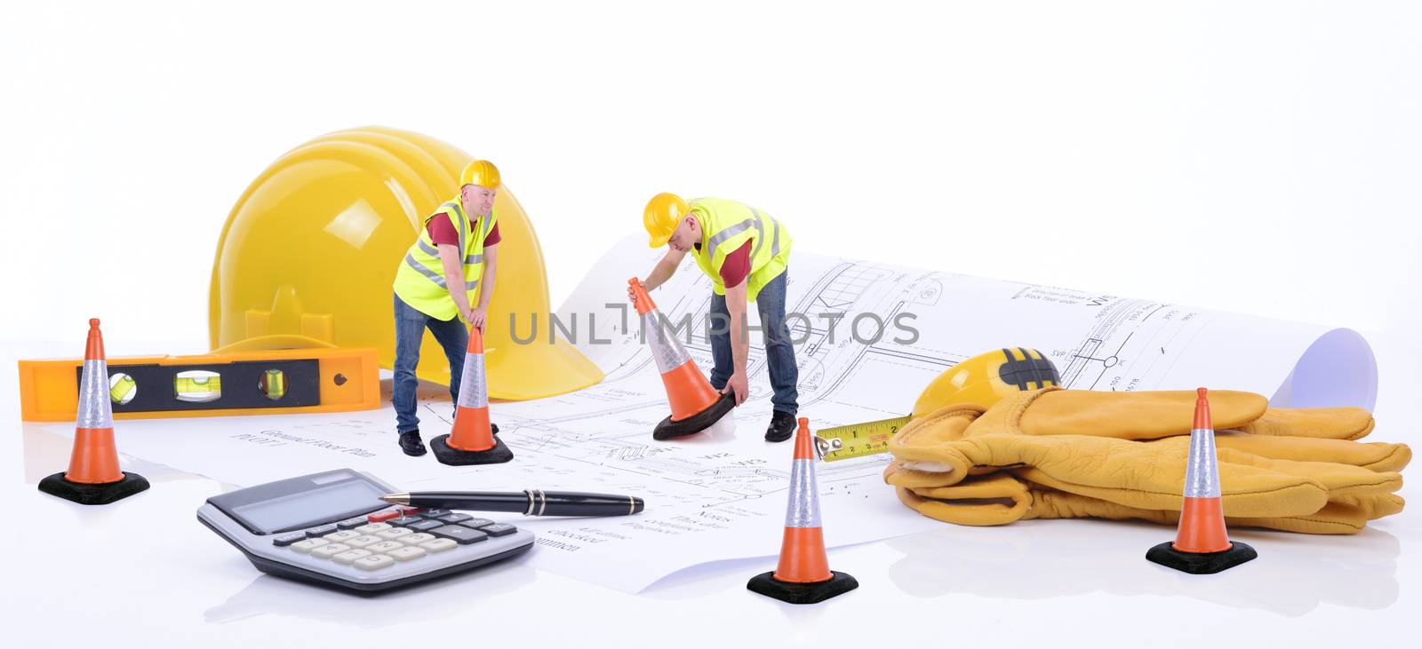 Construction plans with workers and tools isolated on white background