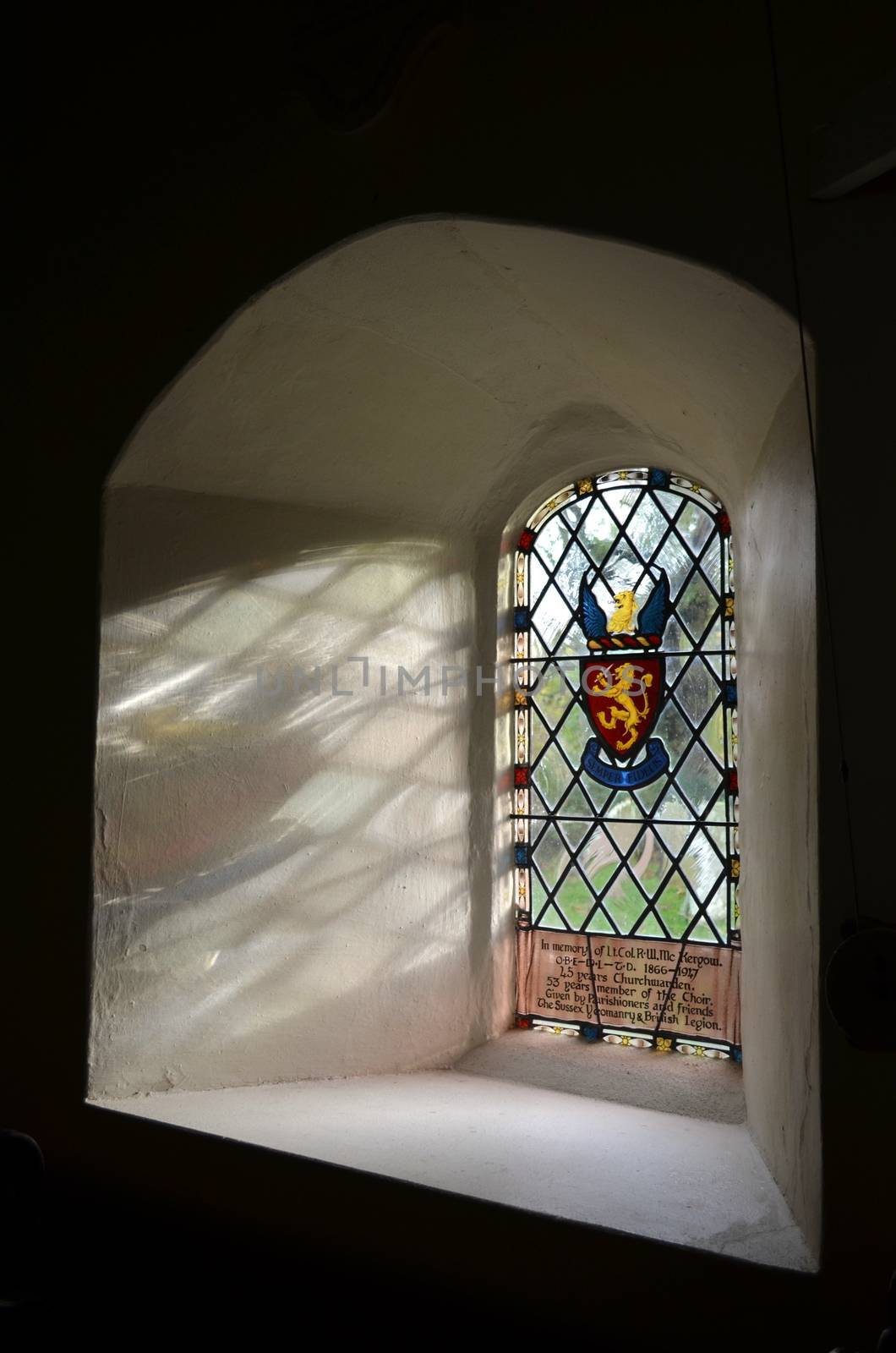 A beautiful recessed stained glass window at St Peters in the tiny hamlet of Twineham in the County of Sussex,England. The church dates from around 1695.