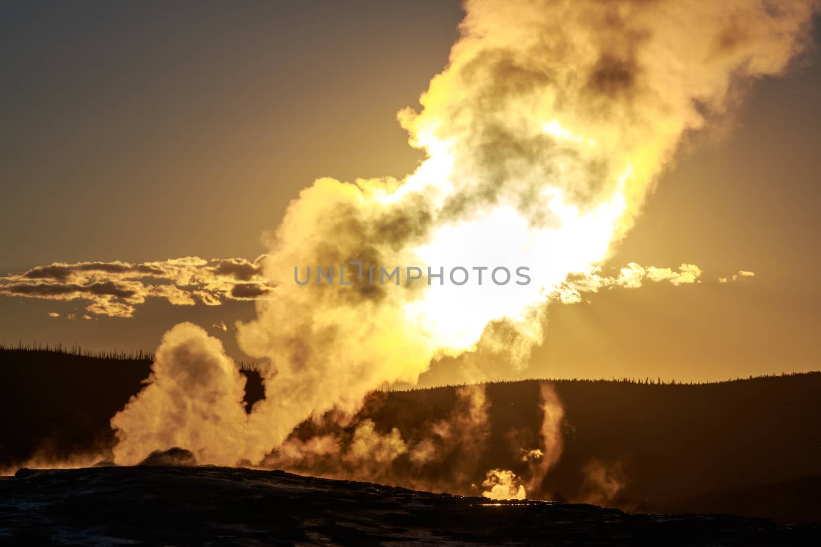 Sunset of Old Faithful in Yellowstone National Park