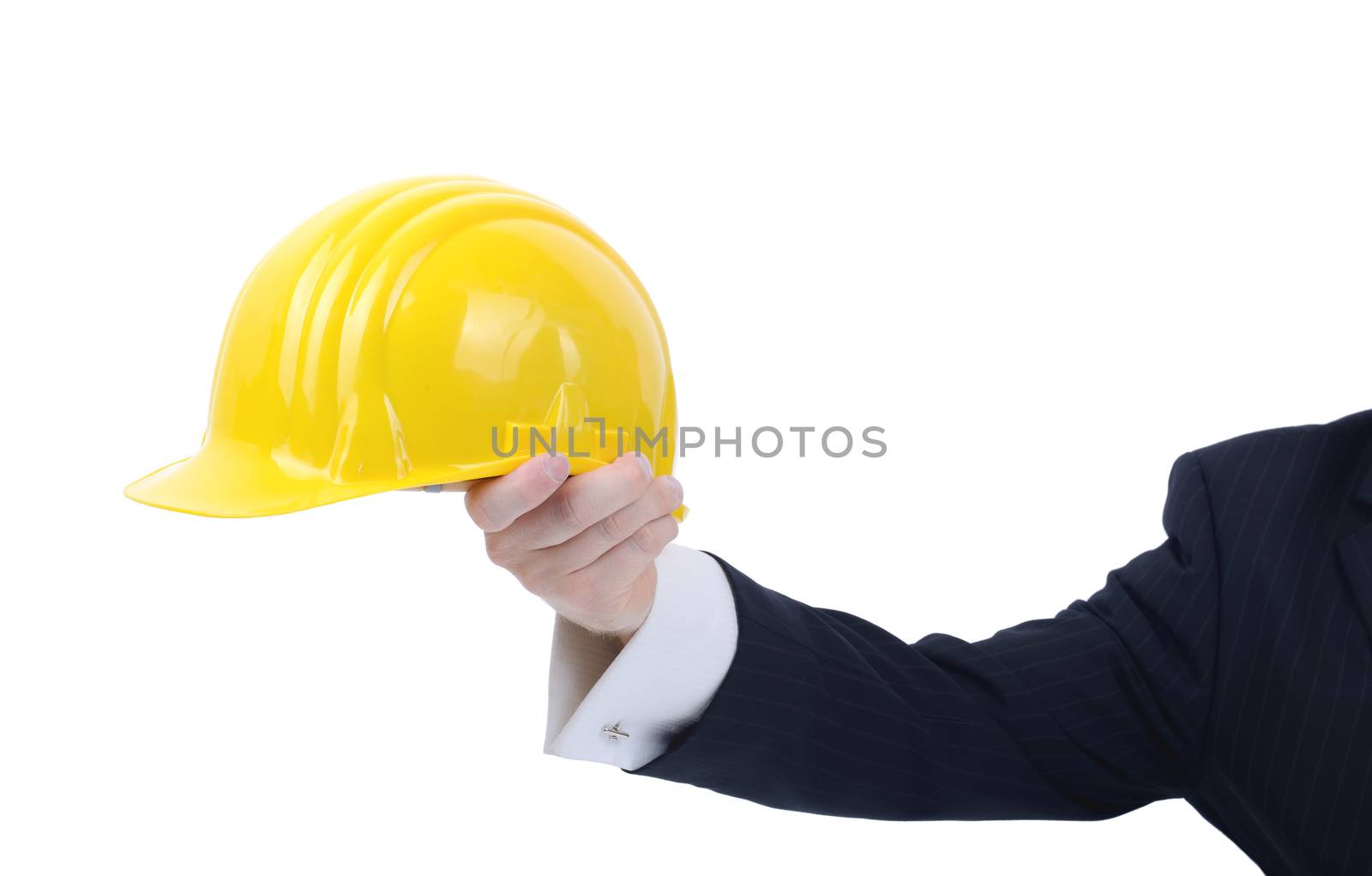 saftey office or site manager holding out a hard hat advising of saftey