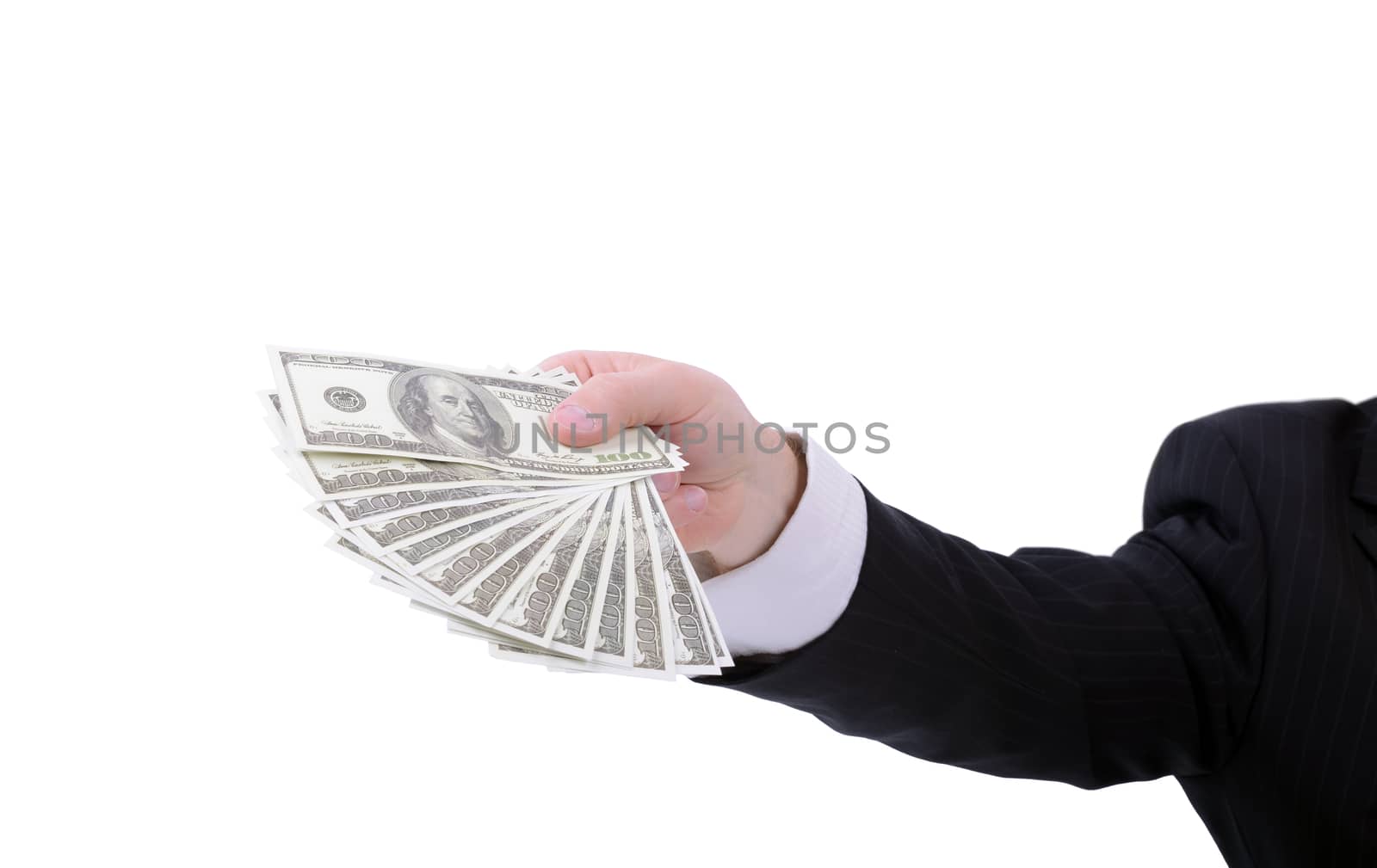 businessman giving a hand full of 100 dolar bills