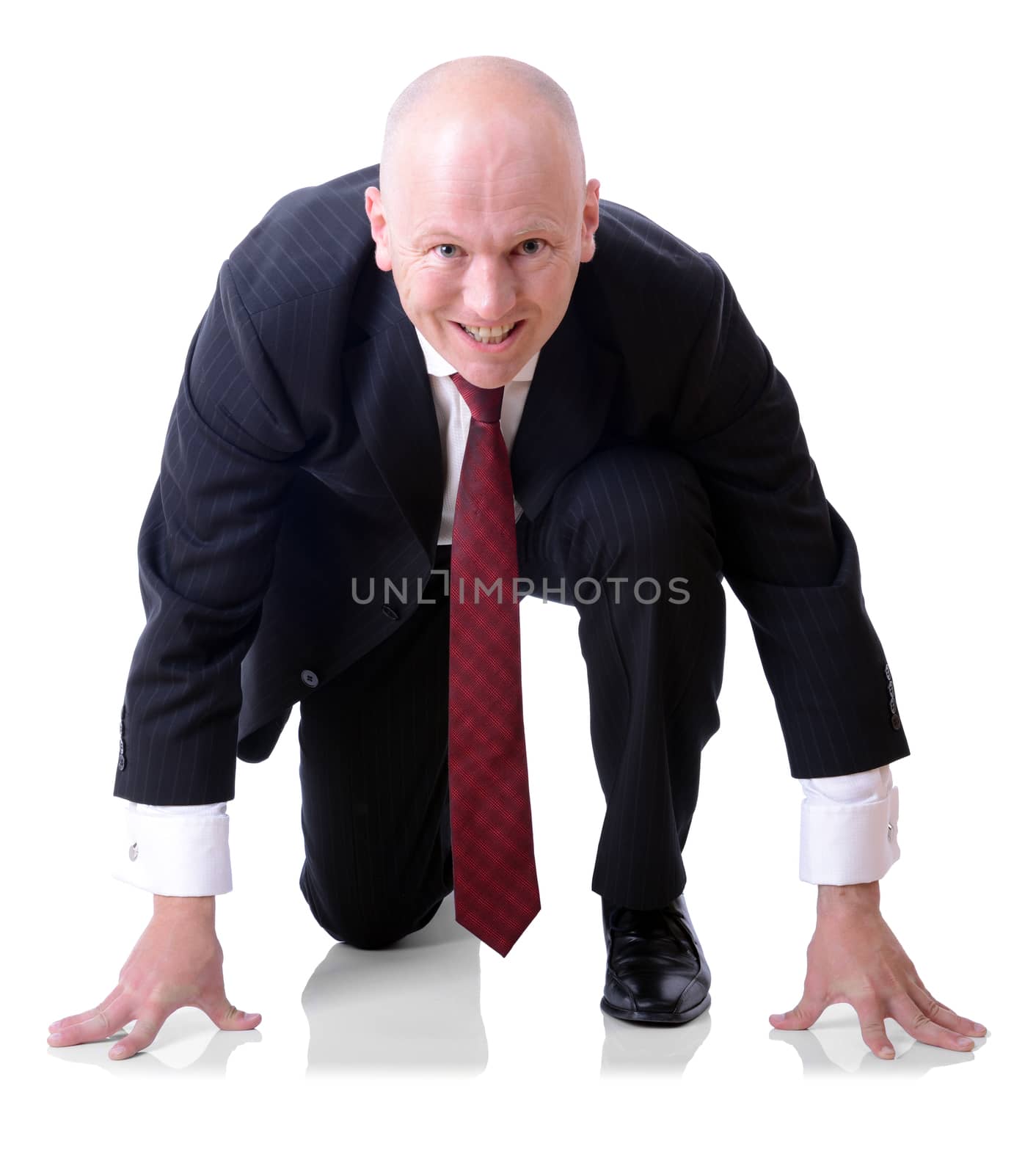 a competitive businessman on the start line isolated on a white background