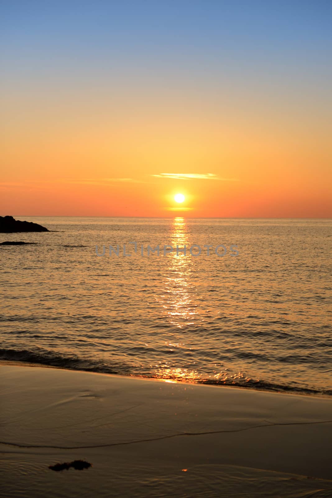 golden sunset on beach high contrast vivid colour image