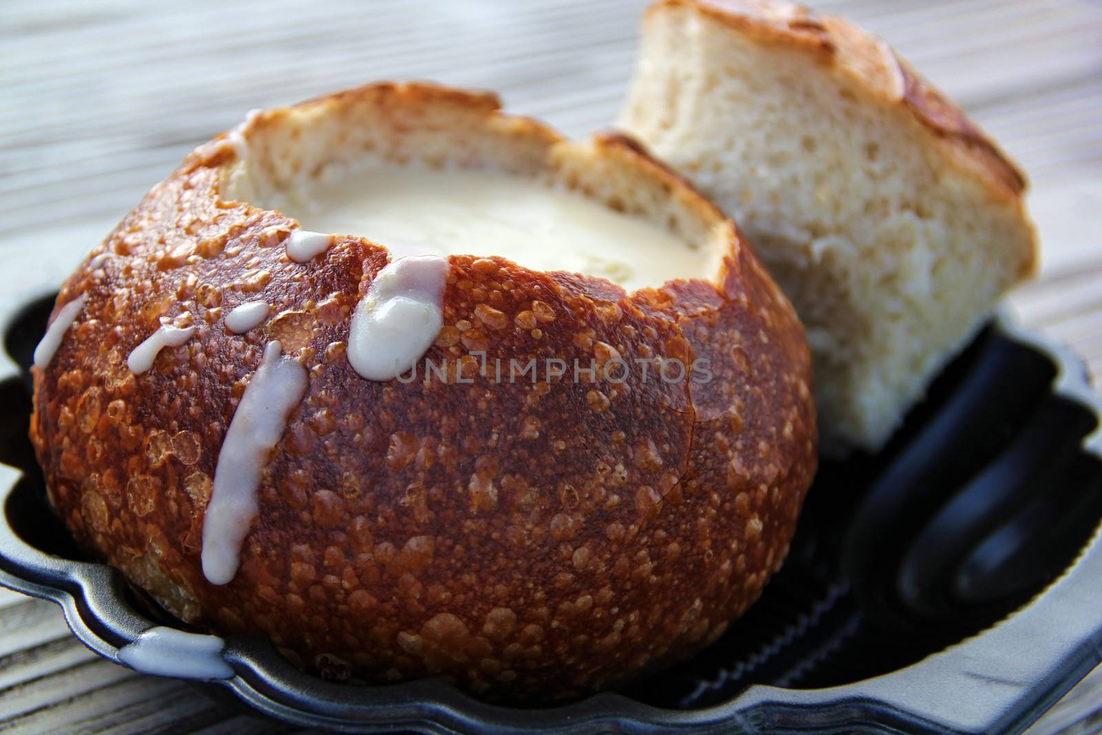 The most famous and popular in San Francisco mussel soup in a pot of bread