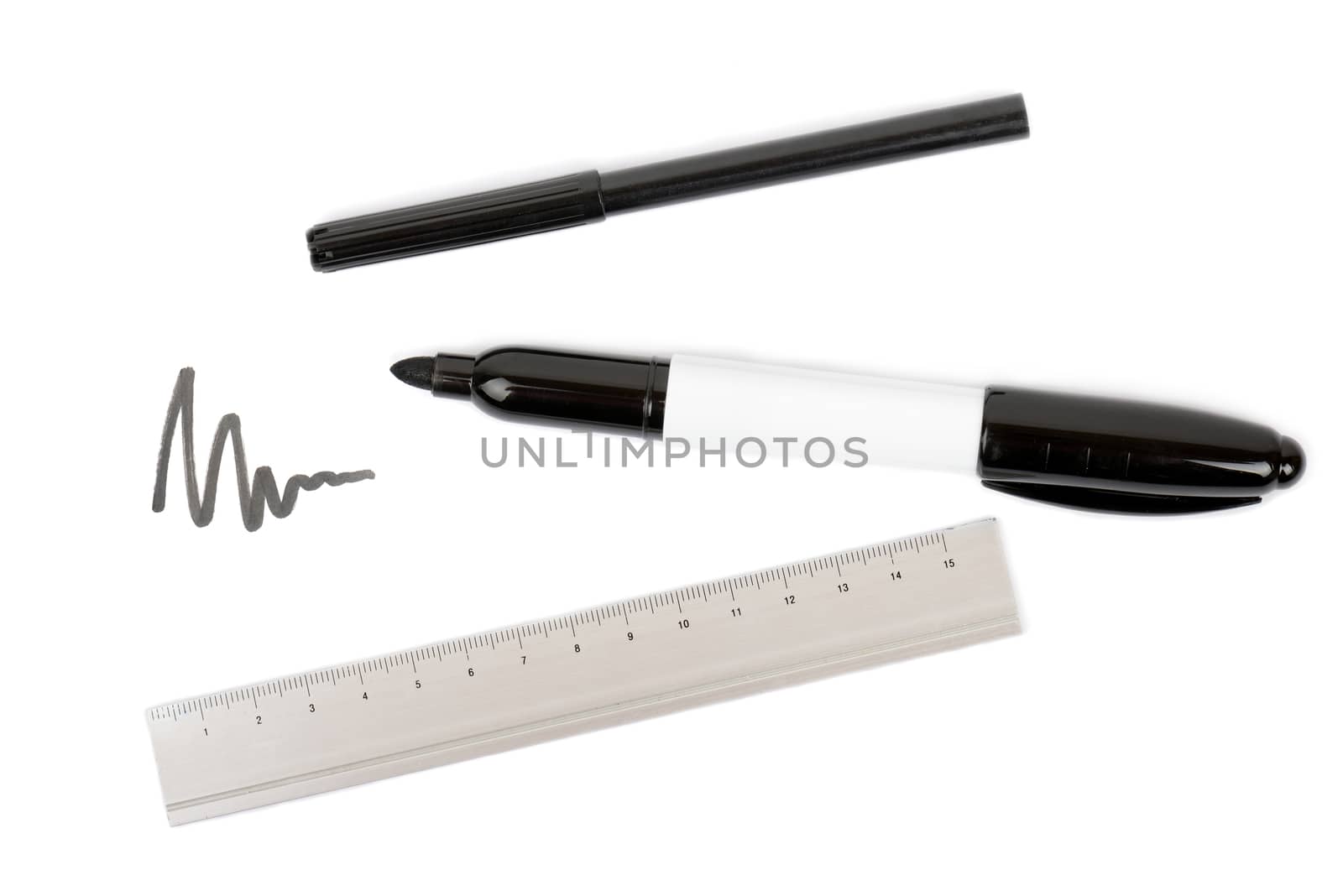 drawing equipmet pens and a ruler on a white background
