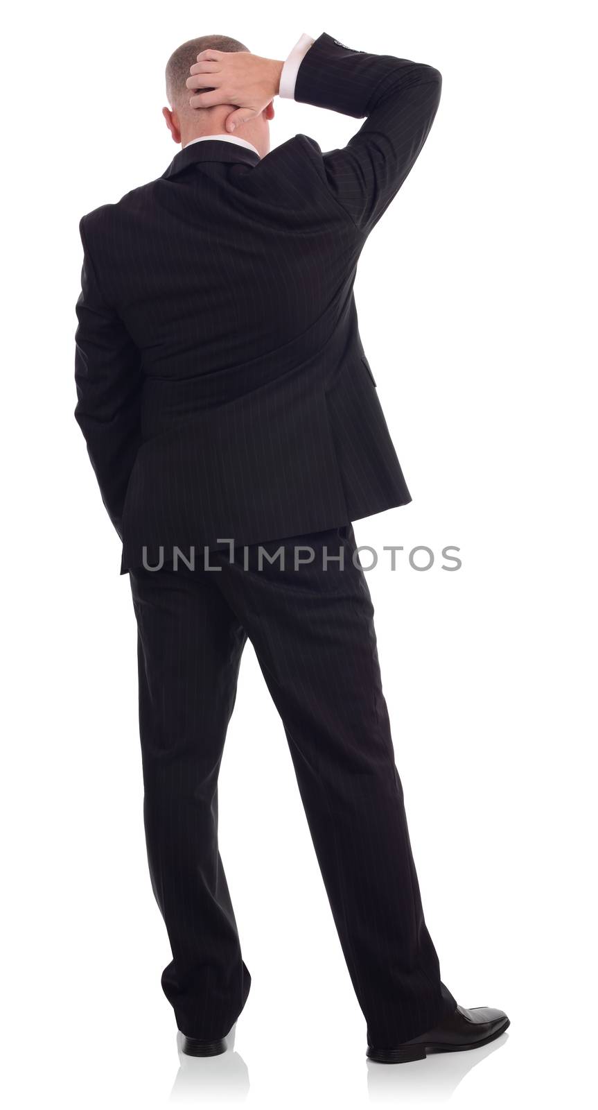 businessman viwed from behind scratching head thinking about something, isolated on a white background