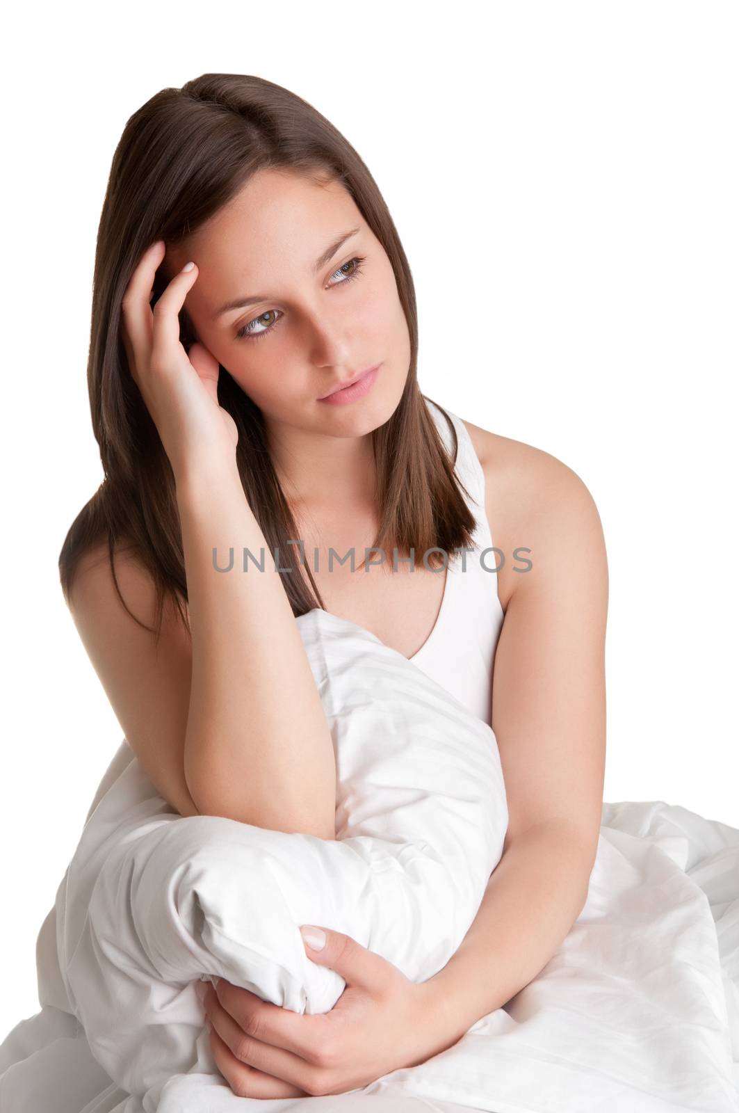Woman sitting on a bed, waking up, isolated in white