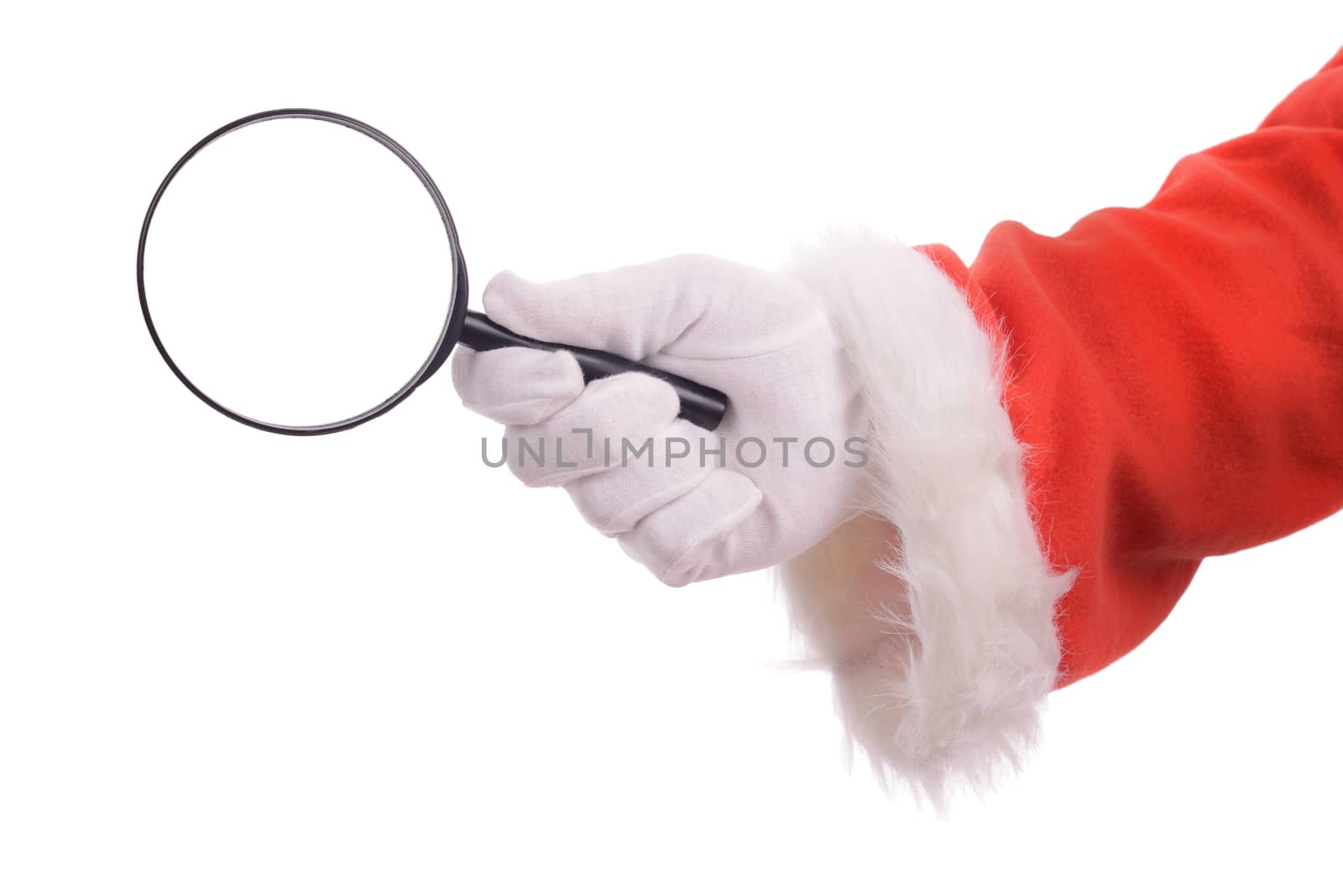 Searching for christmas he perfect gift or bargin, santa's hand holding a magnifiying glass isolated on a white background