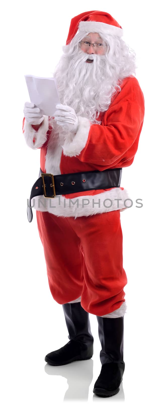 Santa claus reading a christmas list isolated on a white background