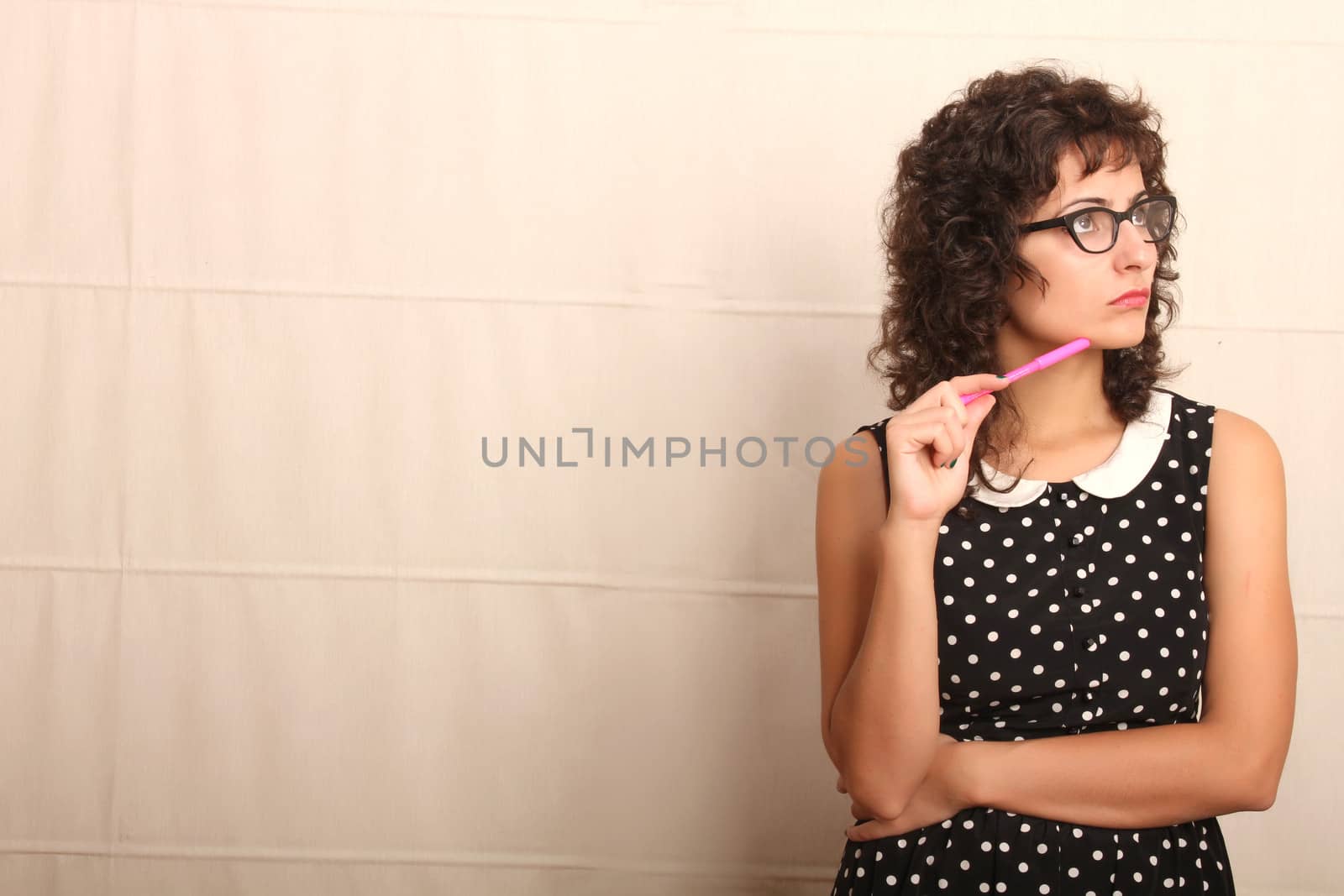 Portrait of a pensive woman in a vintage dress.