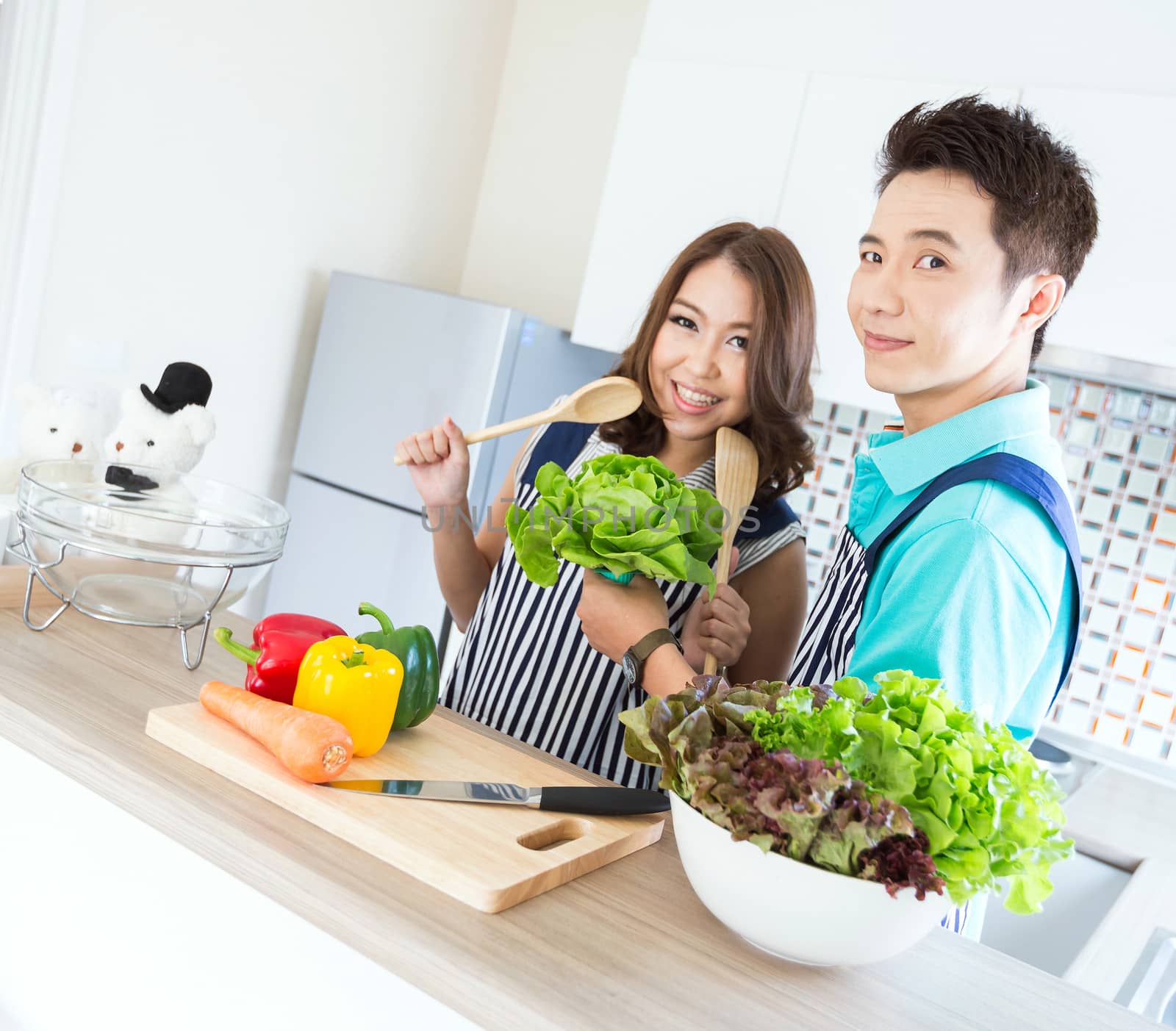 Young happy couples in domestic kitchen