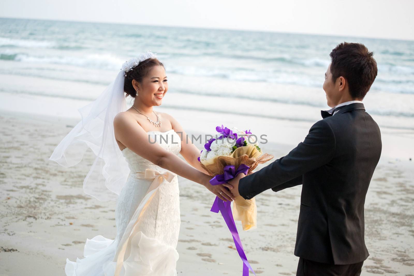 Happy Young Adult Couples in love at beach