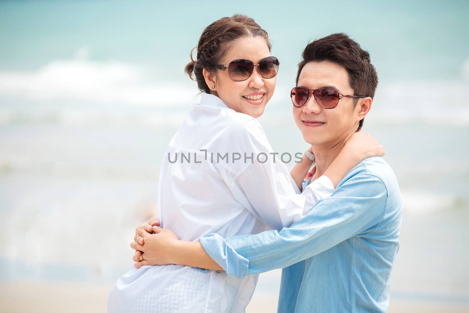 Happy Young Adult Couples in love outdoor at beach